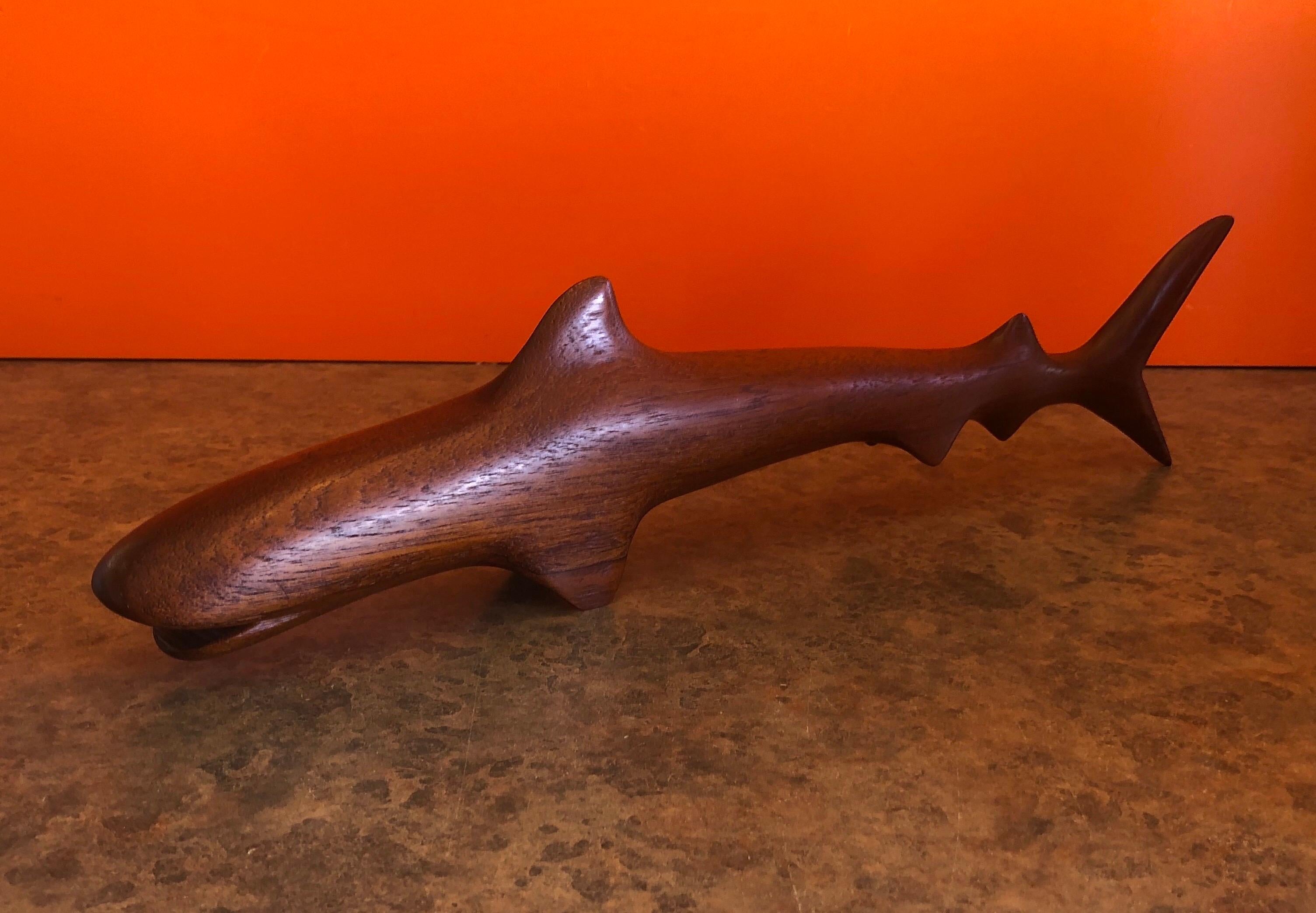 A very cool midcentury Minimalist shark carving / sculpture in teak, circa 1960s. The piece is signed on the underside and measures 16.75