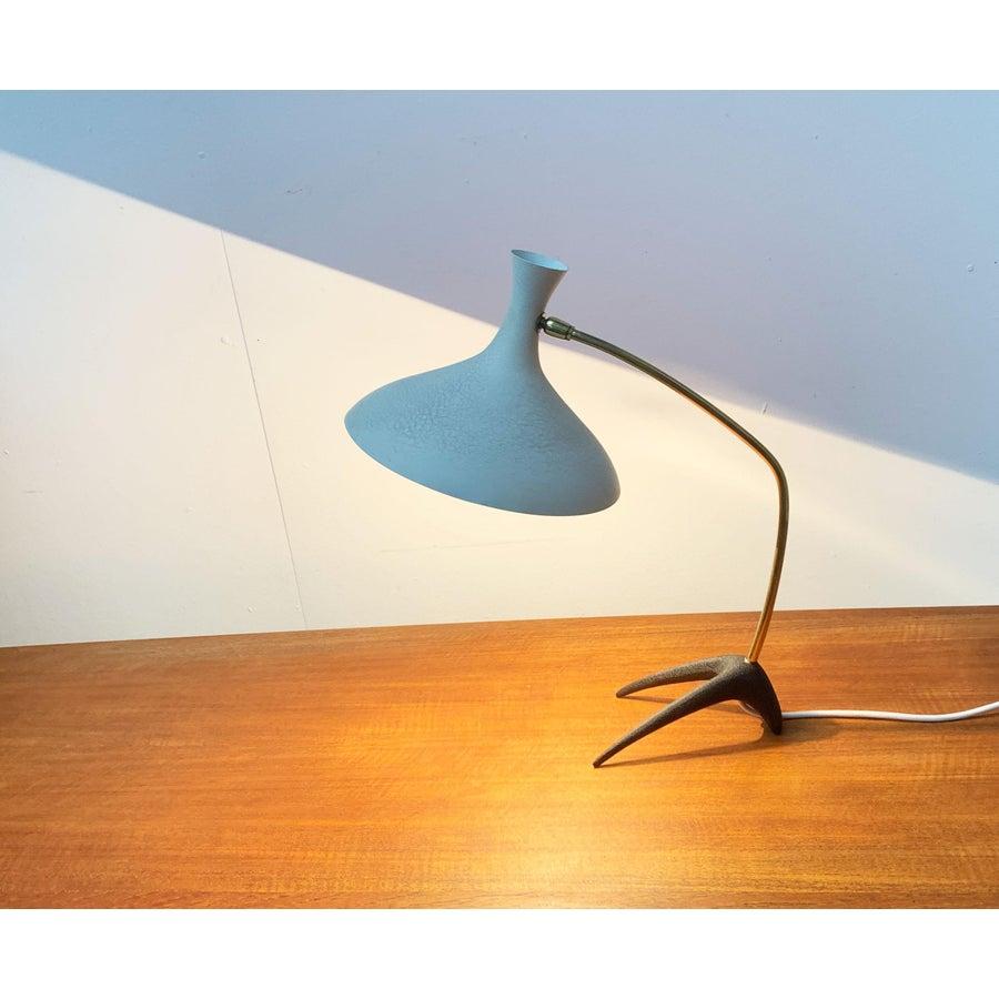 Mid Century table lamp by Cosack. This and similar designs are often attributed to Louis Kalff. However, there are no sources for this. Moreover, Kalff never worked for Cosack.

A sober design with elegant forms. The striking elements of this lamp