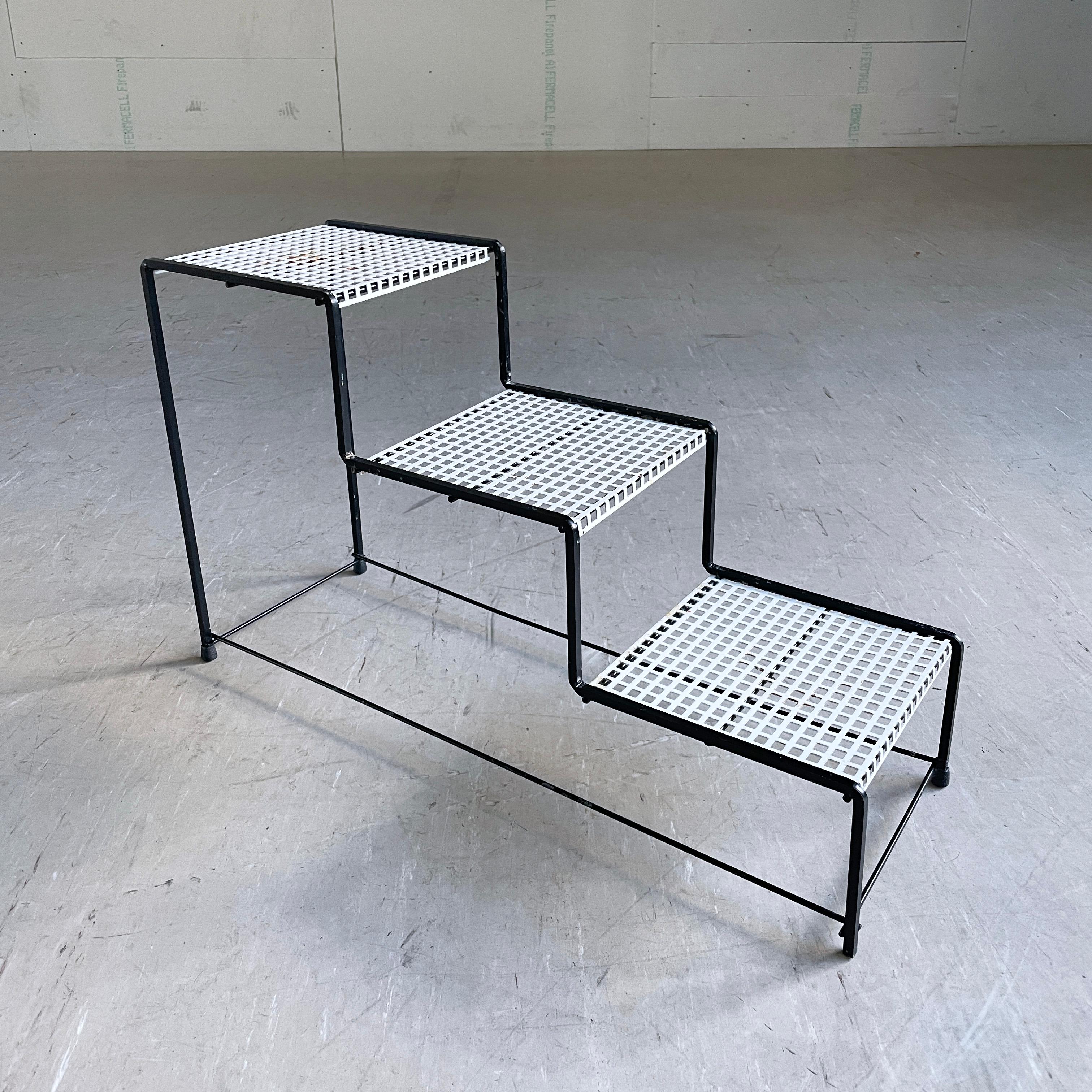 Stylish Mid Century Swiss minimalist tiered plant stand made of perforated metal with rubber feet. Reputedly produced for Möbel Pfister, Switzerland in the late 1950’s, early 1960's (unconfirmed). 
