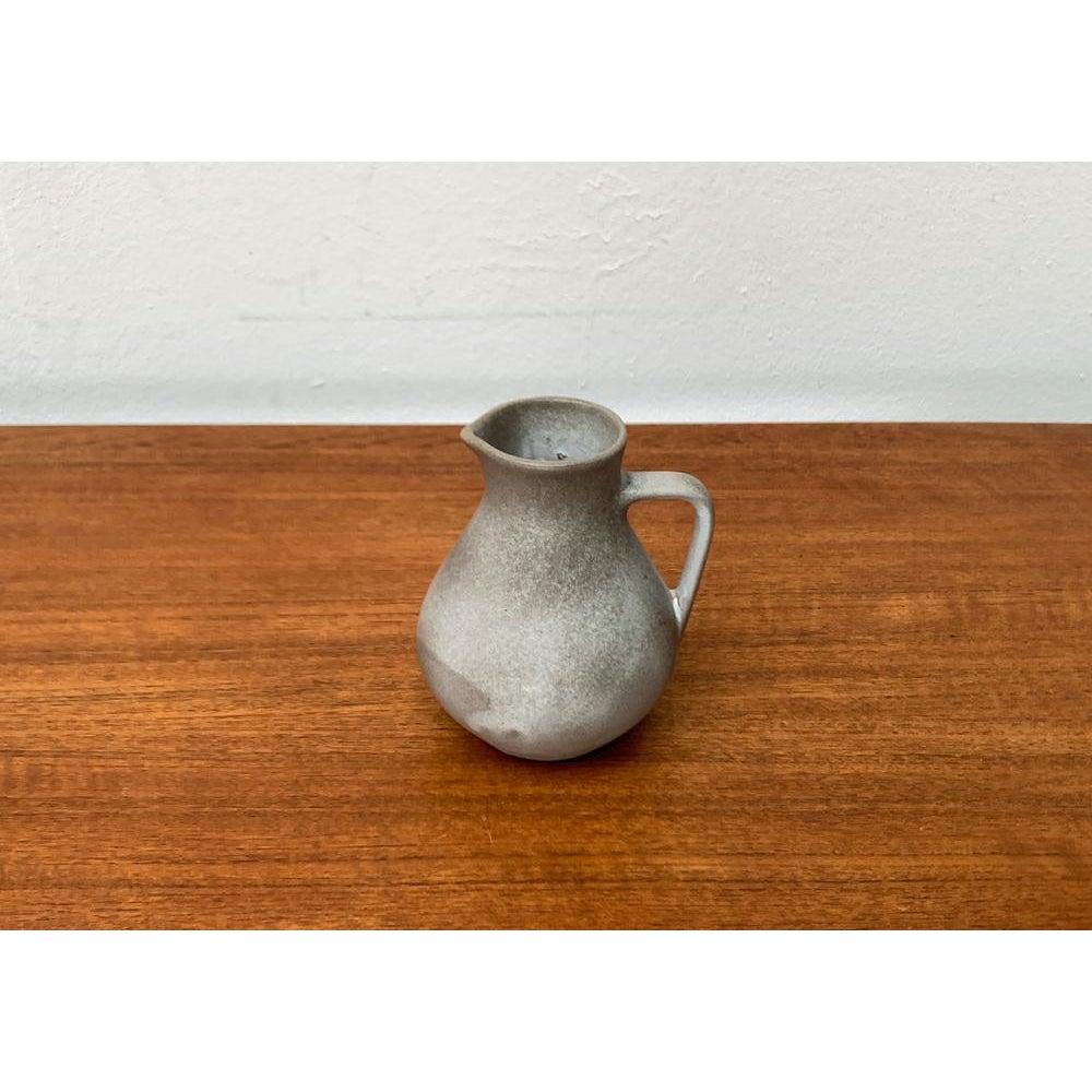 Mid-Century Minimalist WGP West German Pottery Carafe Vase from Marschner Kunsttöpferei, 1960s, in Very Good conditions. Designed 1960 to 1969 This piece has an attribution mark.

Additional information:
Materials: Ceramic
Color: Gray
Styles: