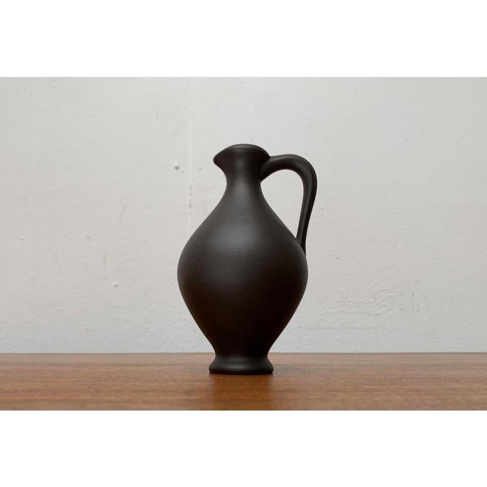 Mid-Century German Minimalist Wormser Terra-Sigillata Pottery Carafe Vase, 1960s, in Very Good conditions. Designed 1960 to 1969 This piece has an attribution mark.

Additional information:
Materials: Ceramic
Color: Brown
Styles: Mid-Century Modern,