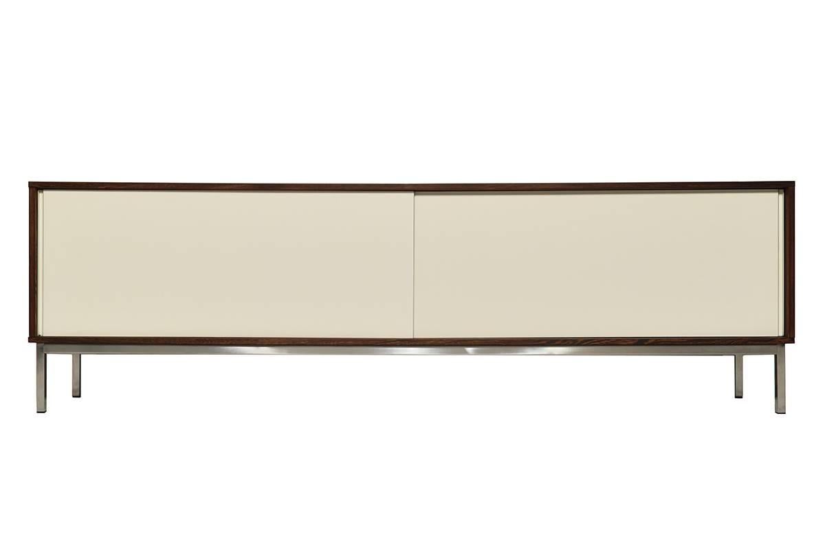 This very rare KW85 Minimalistic sideboard was designed by Martin Visser for 't Spectrum in the Netherlands in the 1960s. It is made from Wenge. It features white sliding laminate doors. The sideboard is an excellent vintage condition.