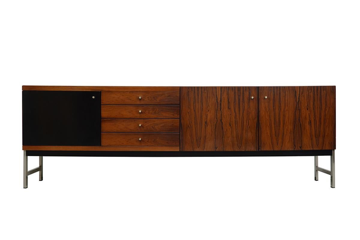 Very rare midcentury minimalistic rosewood Credenza by Fristho. Produced in the 1960s. High quality Dutch made and inspired by the Modern Danish design, Fristho worked with Danish designers. This Credenza is in very good vintage condition.