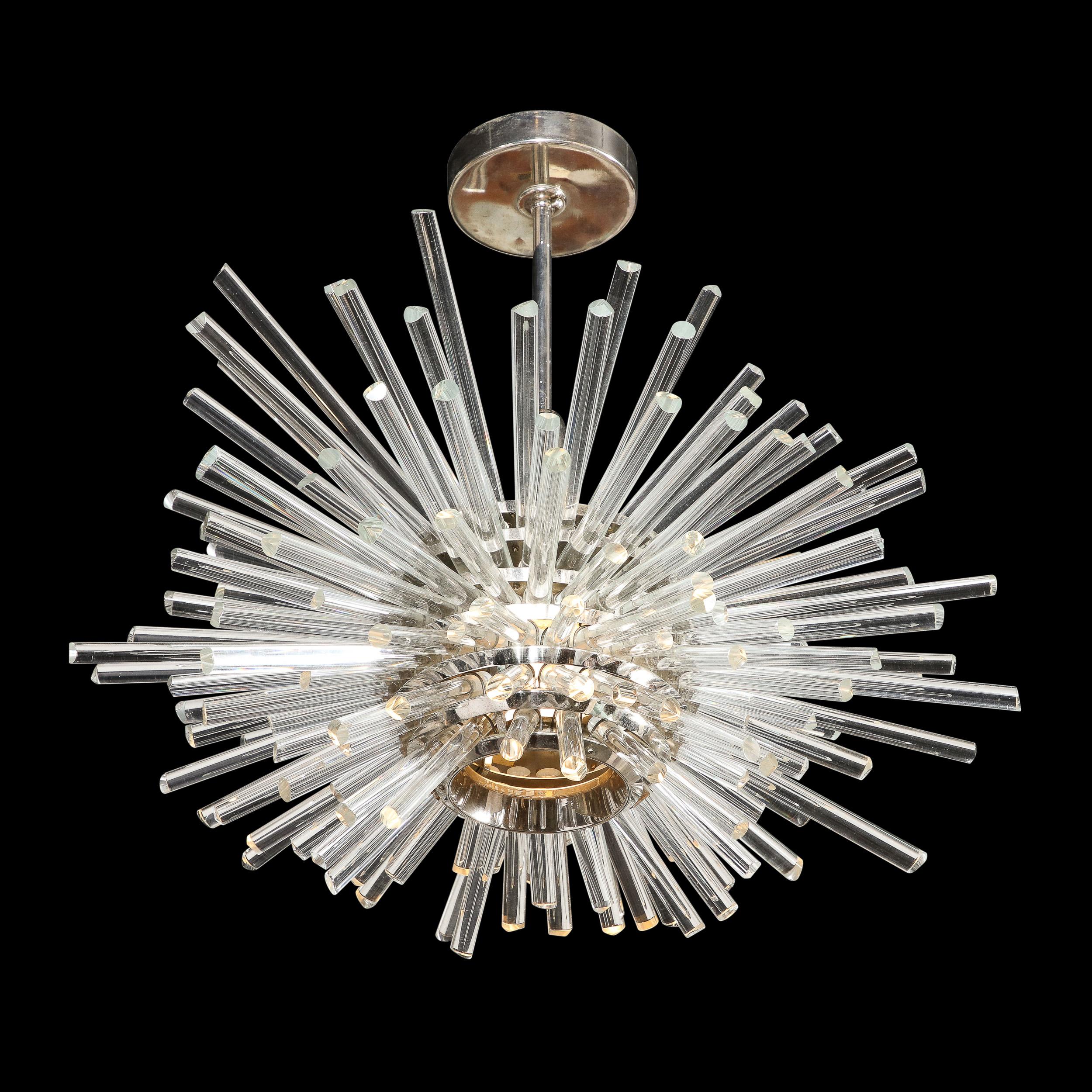 This stunning and dramatic Mid-Century Modern chandelier was realized by the legendary atelier of Bakalowits and Söhne in Austria circa 1960. It offers a spherical body in polished chrome with an abundance of translucent glass cylindrical rods