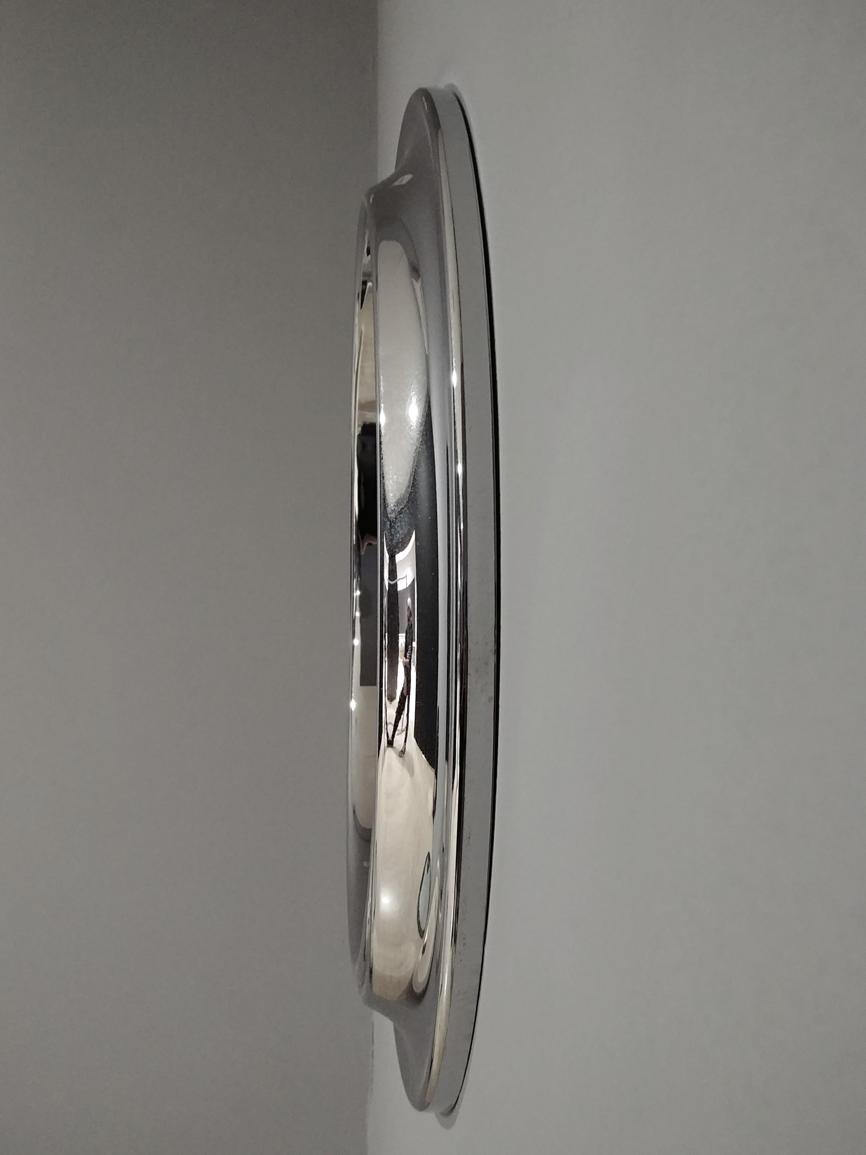 Round smoked glass mirror with chromed aluminum structure, circular in shape. Italian production, 1970s.