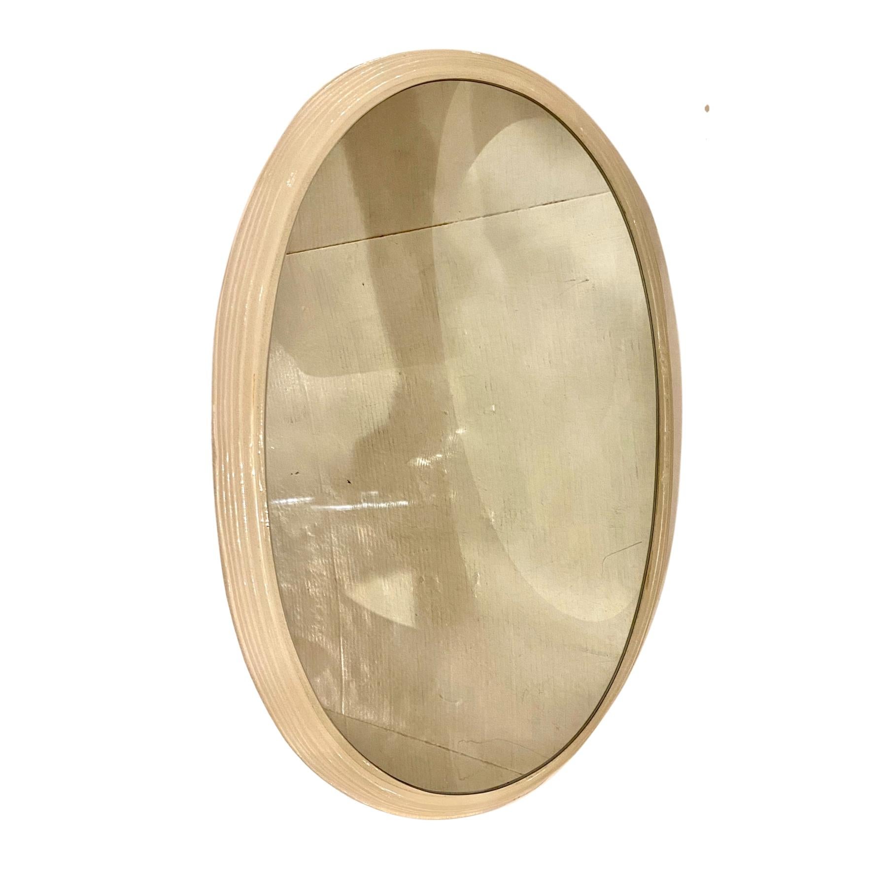 A circa 1960s Italian oval resin-framed mirror with backlight.

Measurements:
Height 24.5