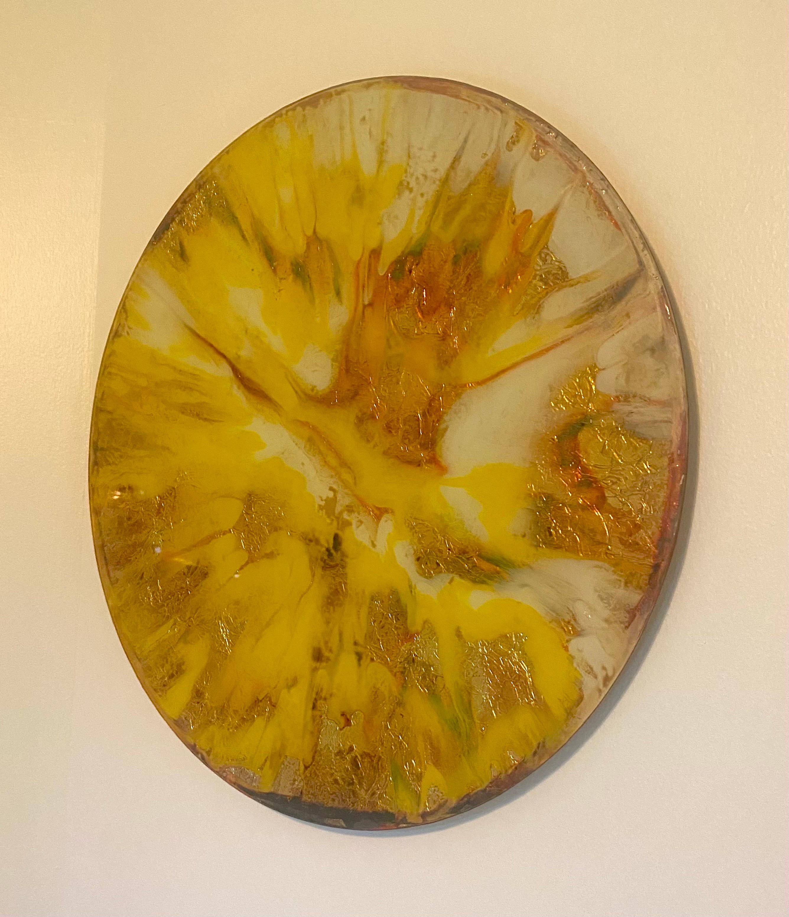 A very unique handmade mixed media glass, gold leaf, thick acrylic paint, in abstract, wall art disc. The backing is in hide with wiring for hanging. This wall sculpture is a joyful piece of sunshine in the home.