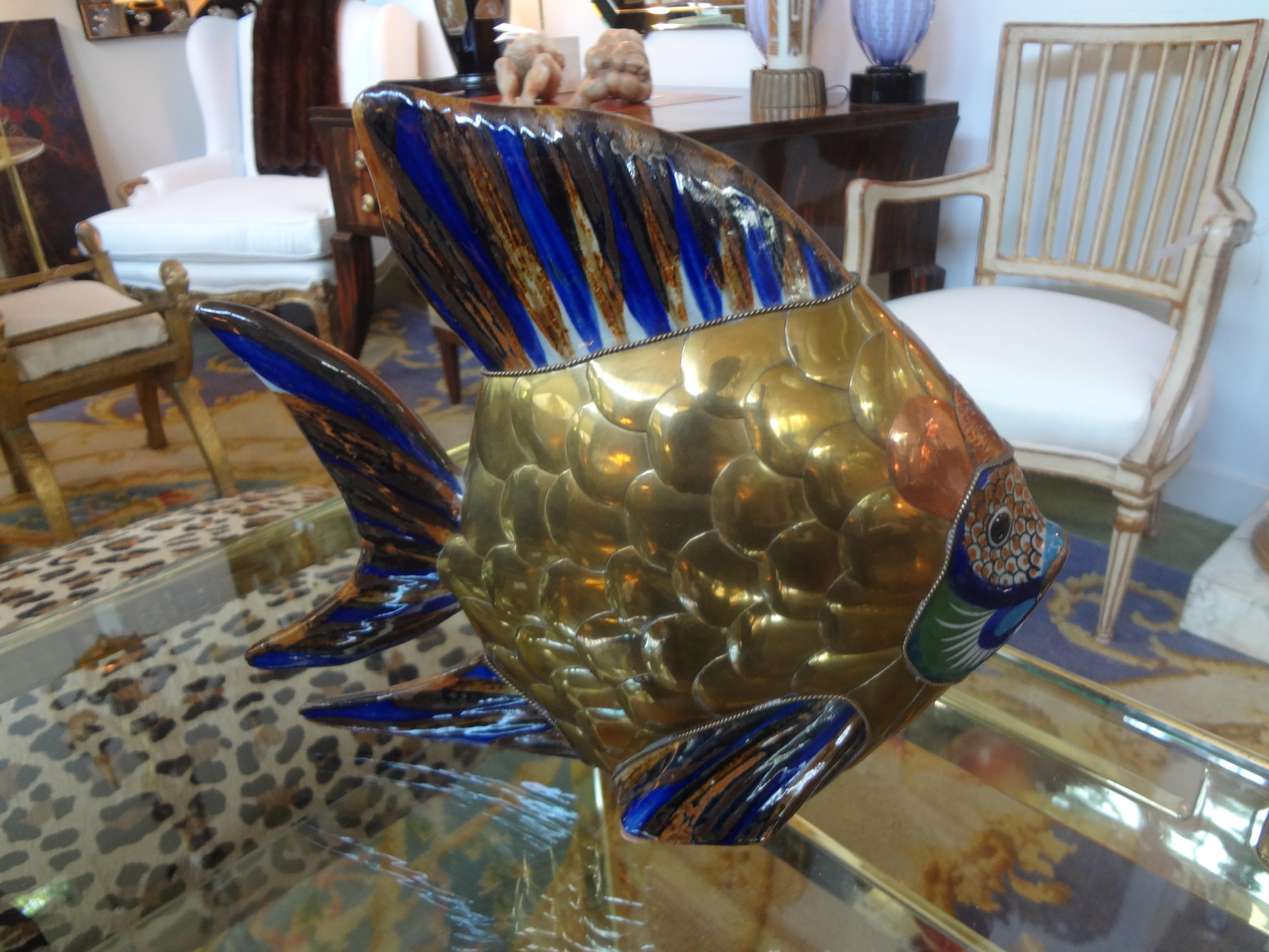 Stunning vintage Midcentury brass, copper and glazed pottery fish sculpture. This Hollywood Regency mixed metal sculpture dates to the mid-20th century.