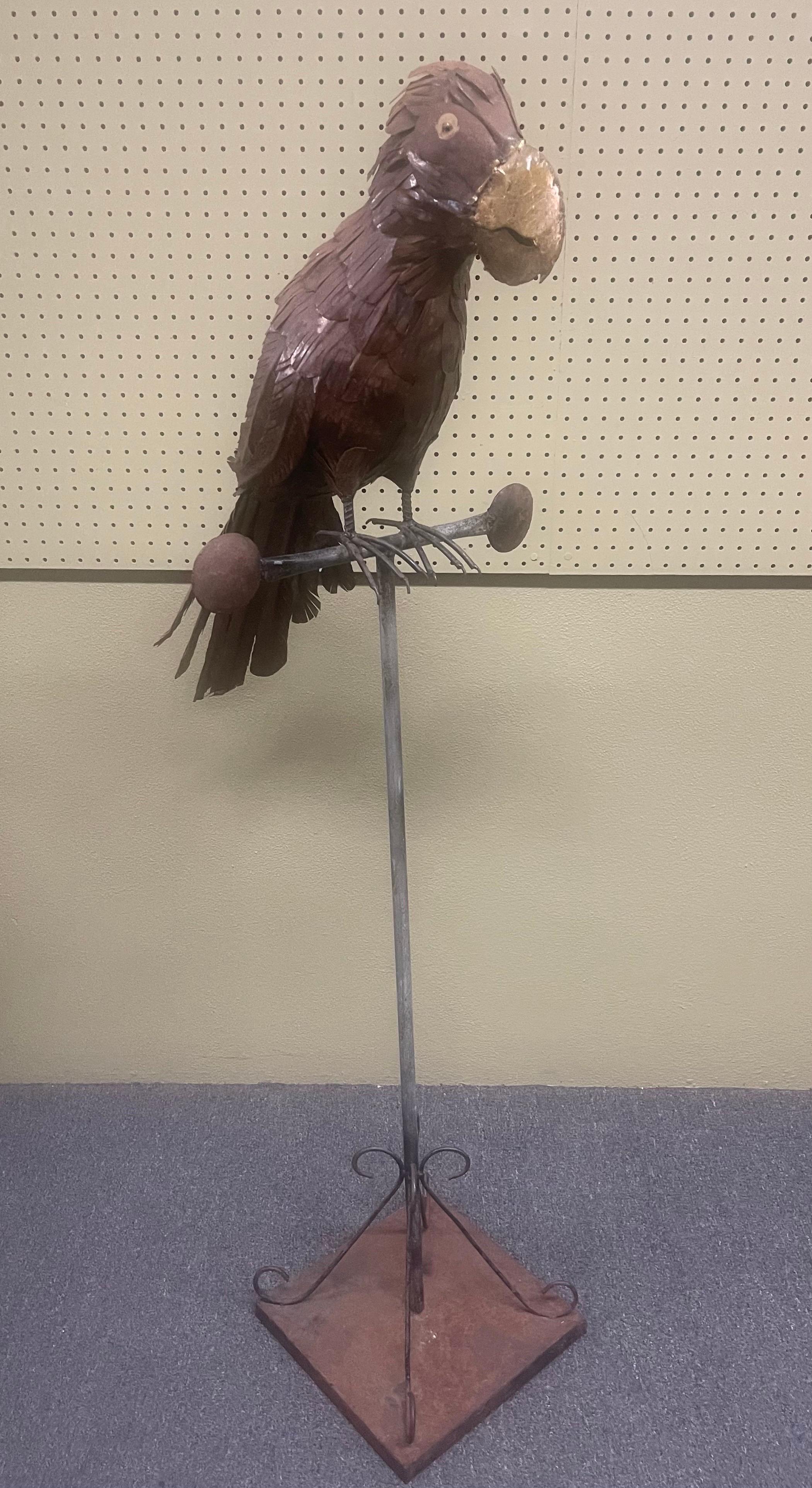 Mid-century mixed metals parrot on perch sculpture in the Ssyle of Sergio Bustamante, circa 1970s. The piece has a rust distressed patina and would look great on an outdoor patio. It is structurally sound and measures 13.5