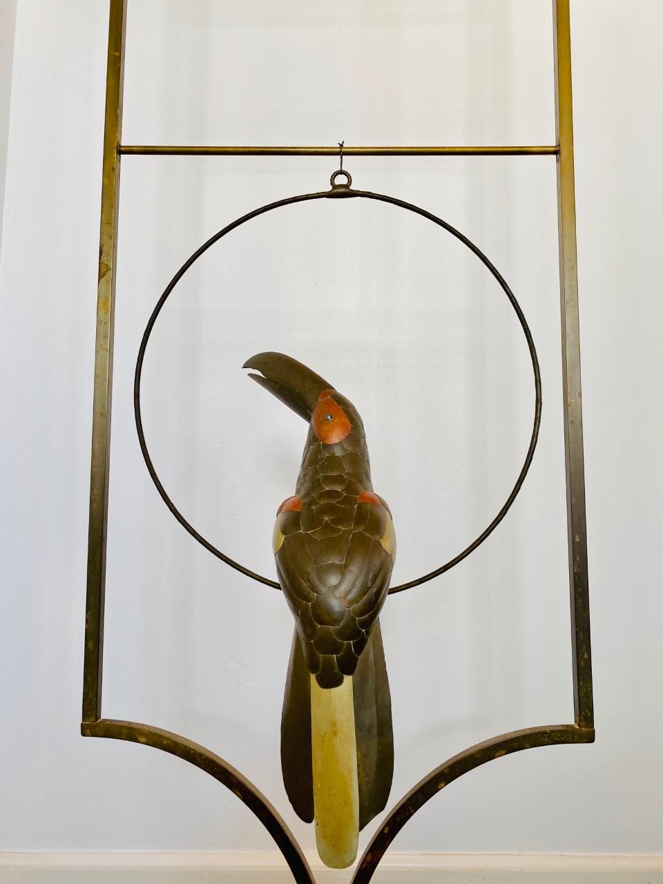 Sculptural Toucan Bird on a perch, made of mixed metals (copper, brass, nickel). This 1970s piece follows the style of Sergio Bustamante. The mix of metals adds vibrancy and depth to the form and the details on the feathering and expressions allude