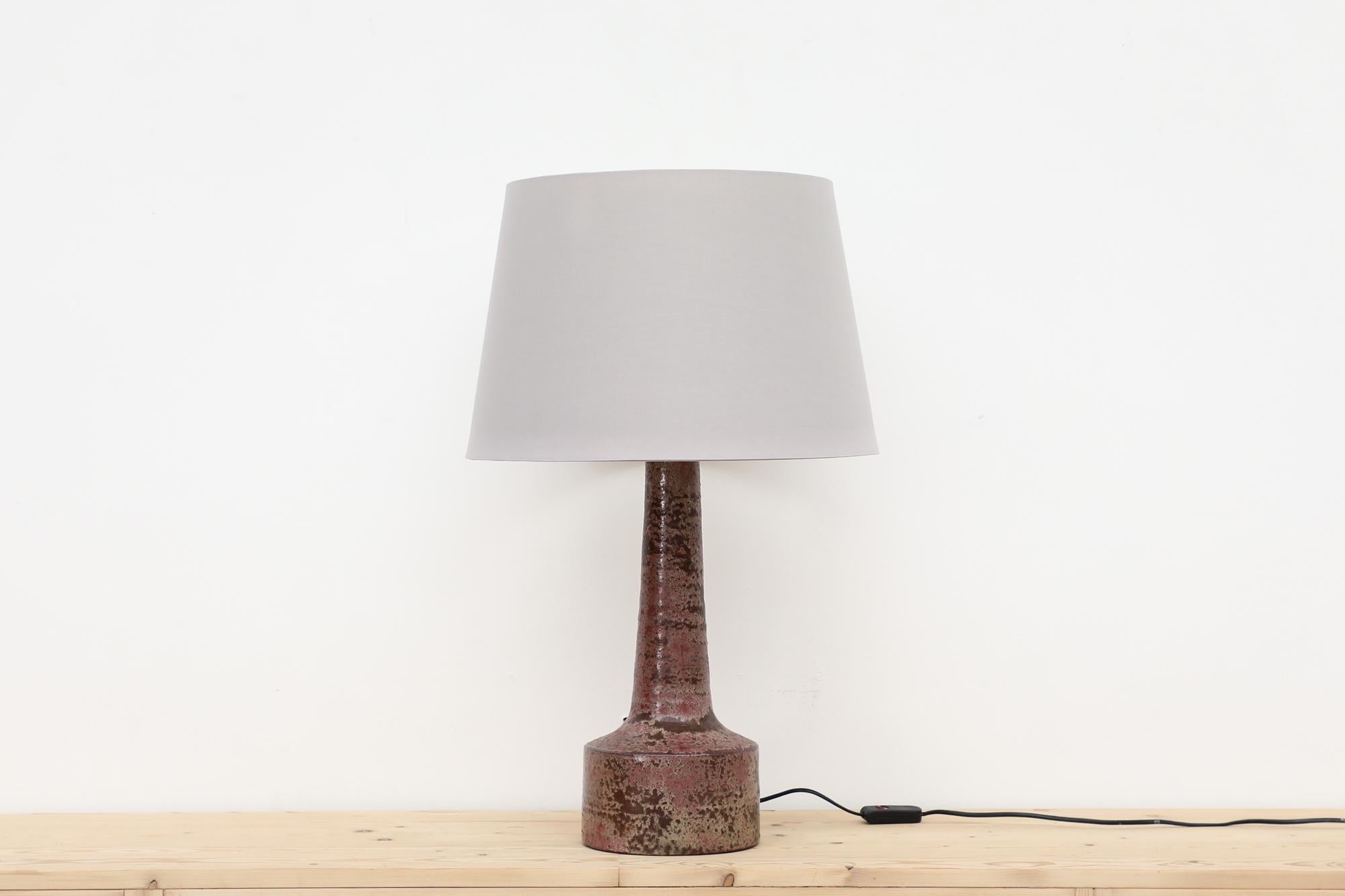 Beautiful Mobach hand thrown mid century Dutch ceramic table lamp base with mauve and taupe speckled glaze. Shown with a newer light gray shade. In original condition with visible wear, including scratching. Wear is consistent with its age and use.