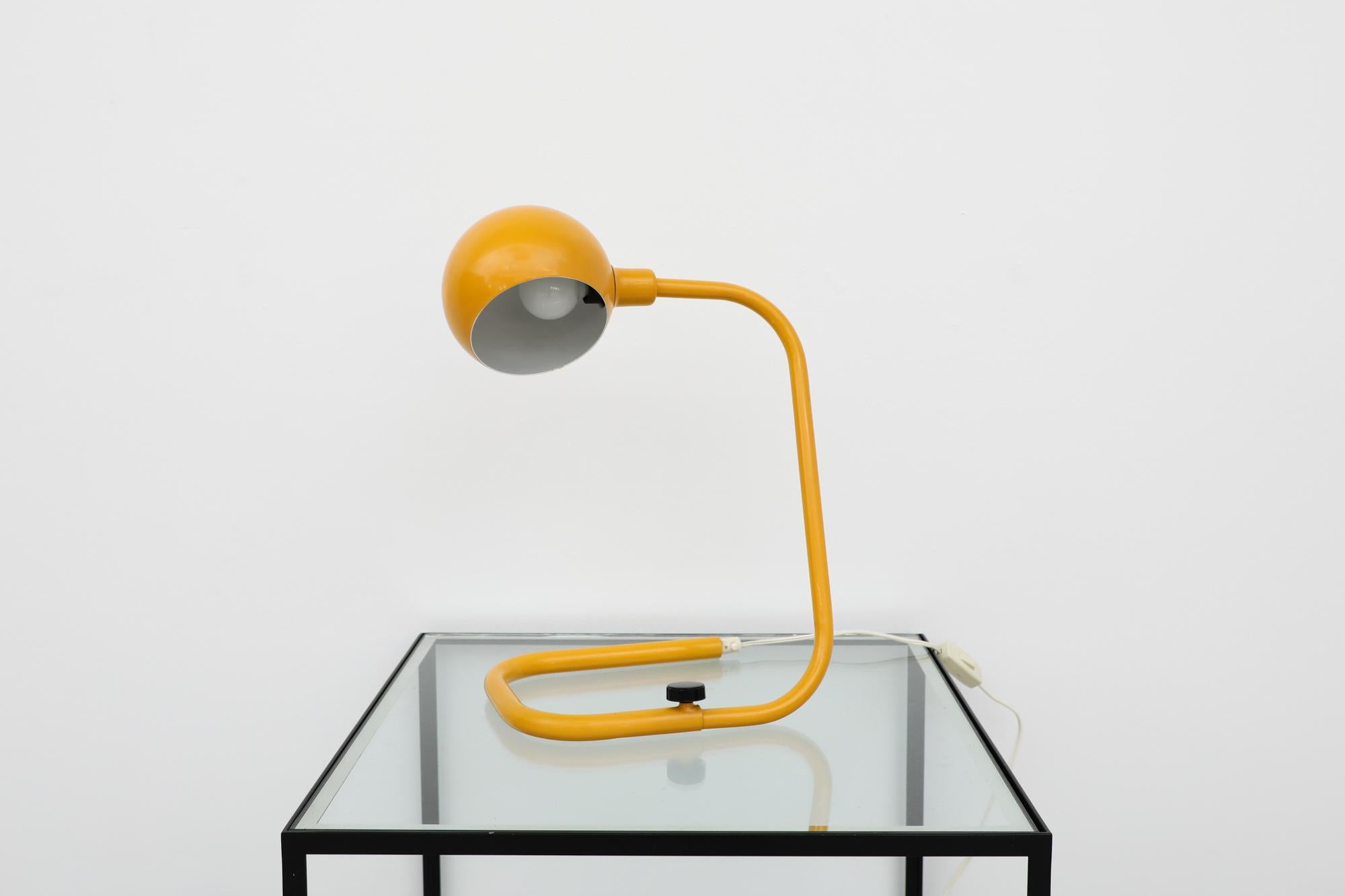 MOD Hebi style adjustable table lamp with Yellow enameled aluminum stem and diffuser. In original condition with white cord and switch.