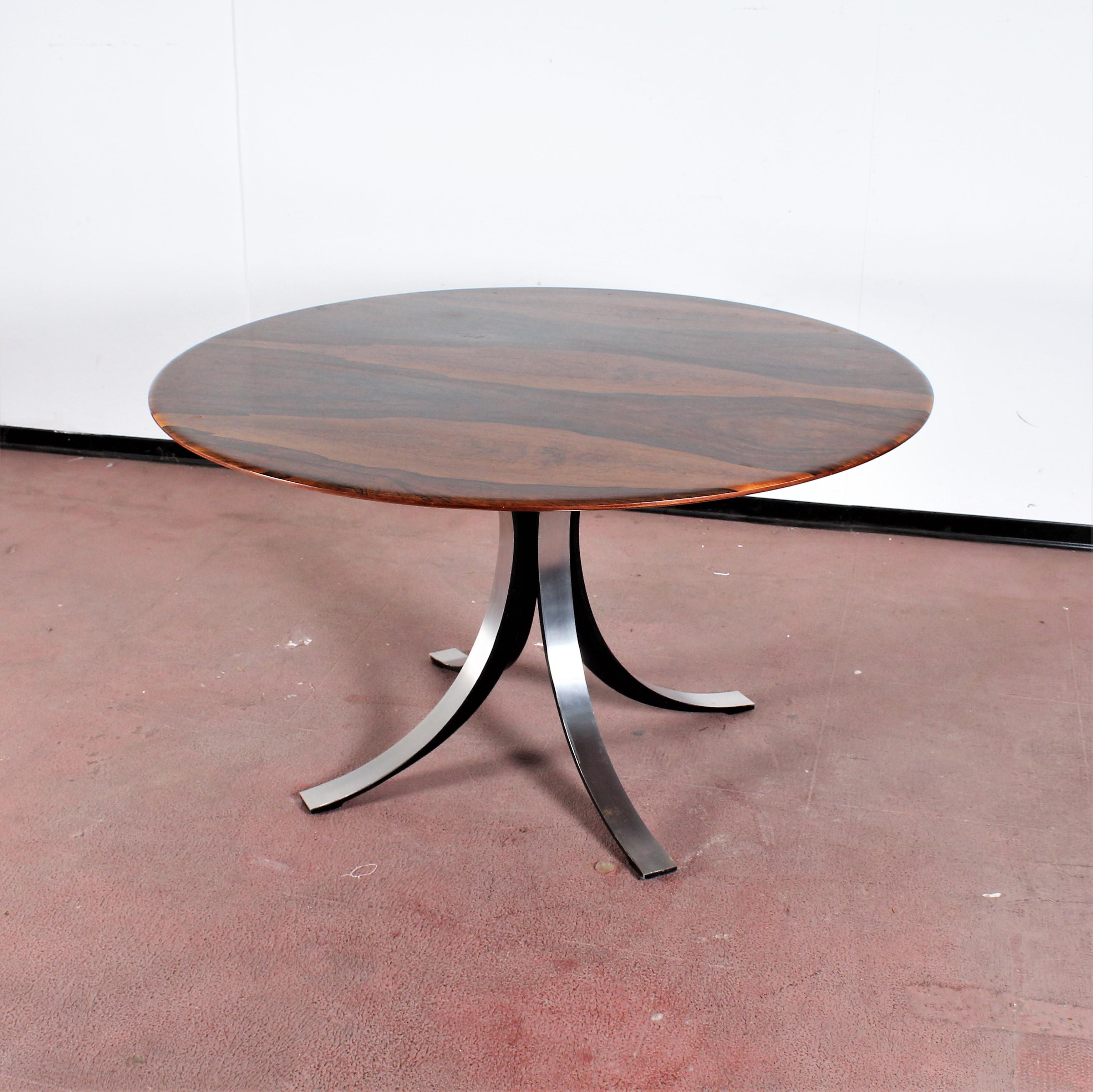 Beautiful dining table with circular top in lacquered brown wood with four saber feet in brushed metal. Mod. 69 by Osvaldo Borsani and Eugenio Gerli for Tecno in 1963.
Wear consistent with age and use.

Take a look at our sales proposal for the