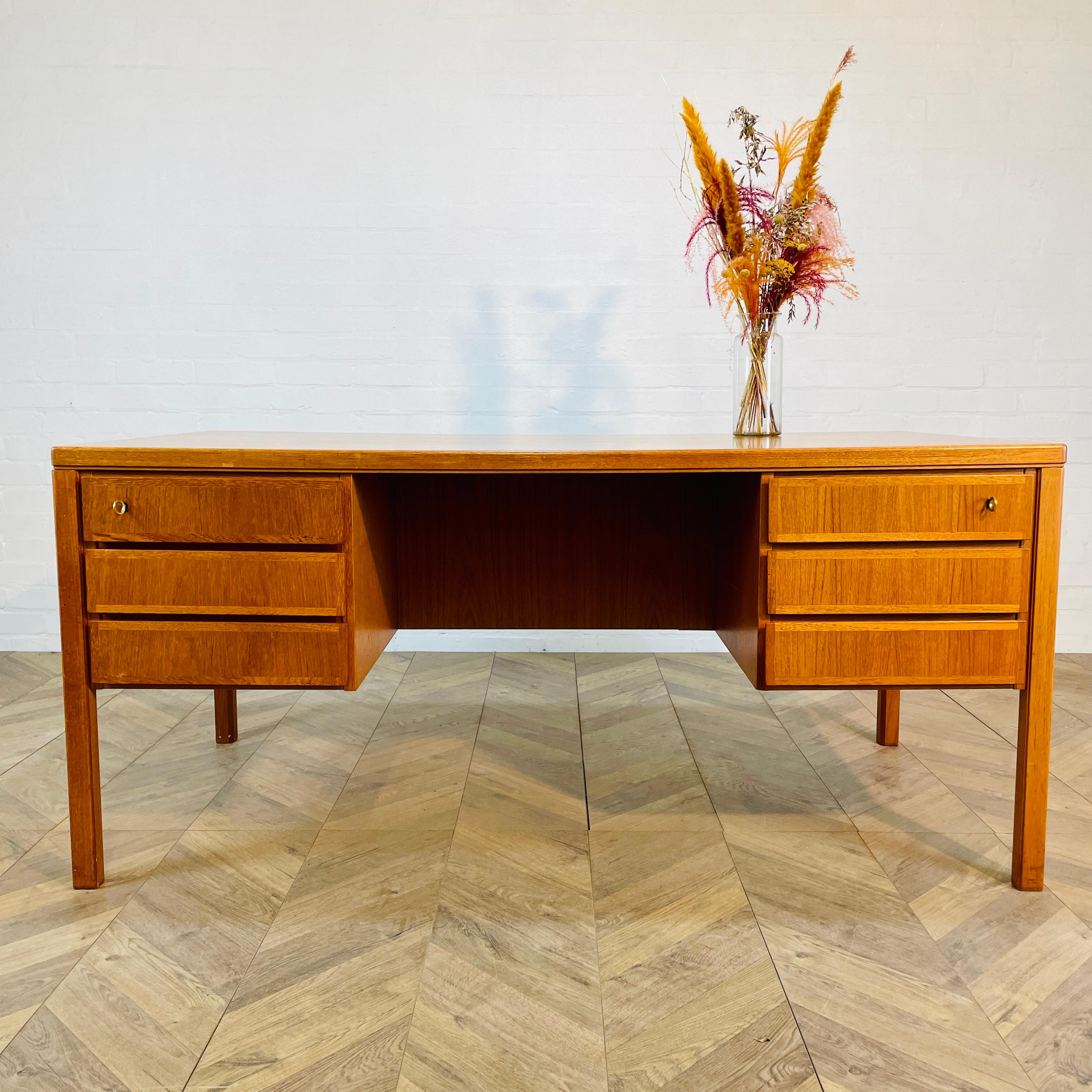 A Beautiful Double-Sided Desk, Model 77 Executive Desk Designed By Gunni Omann For Omann Jun Mobelfabrik, Denmark. Circa 1960s.

The desk is in excellent vintage condition with only small age related marks and scuffs. (please see photos).

The desk