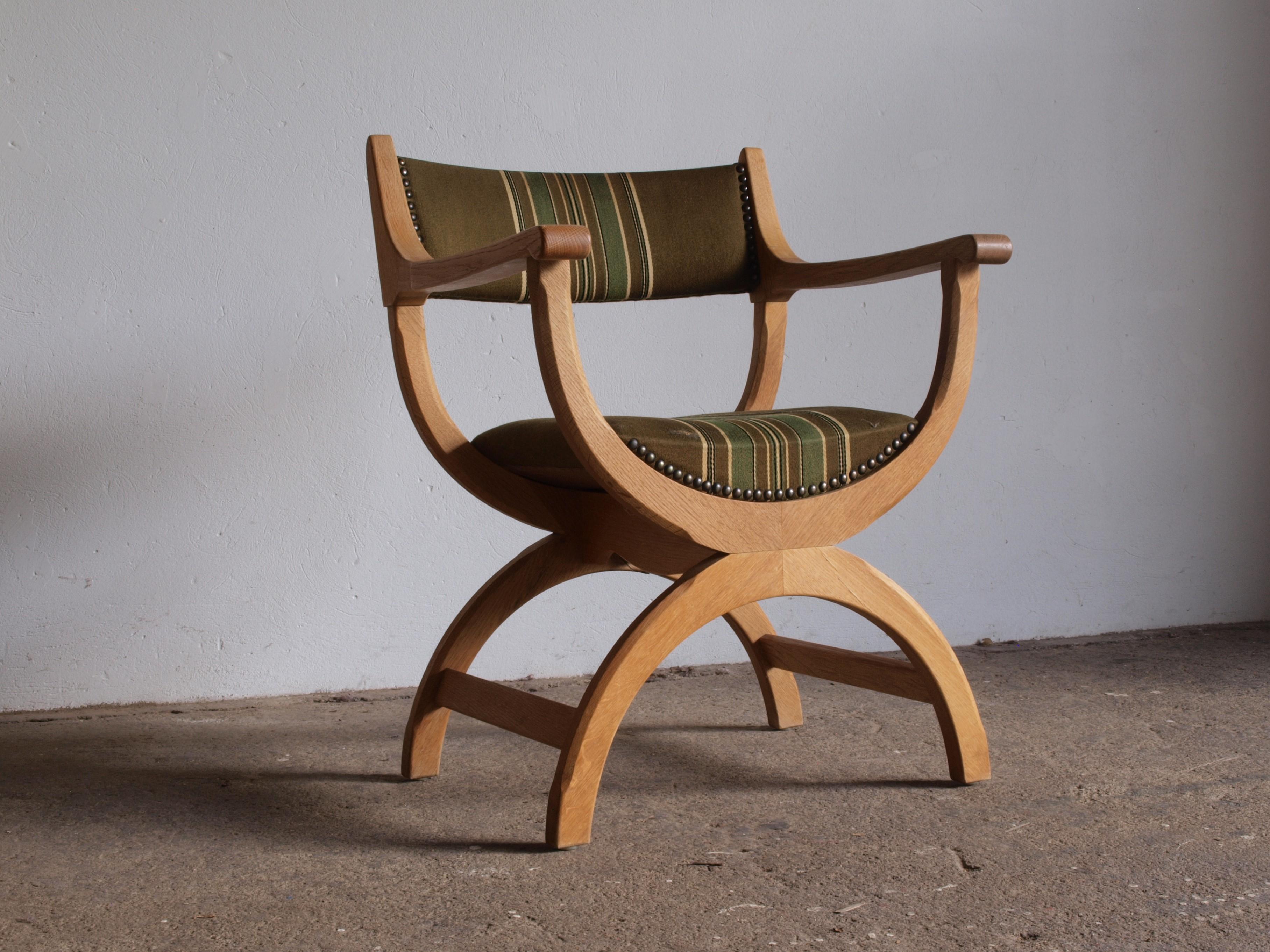 A beautifully crafted armchair in solid oak. This chair, known as 