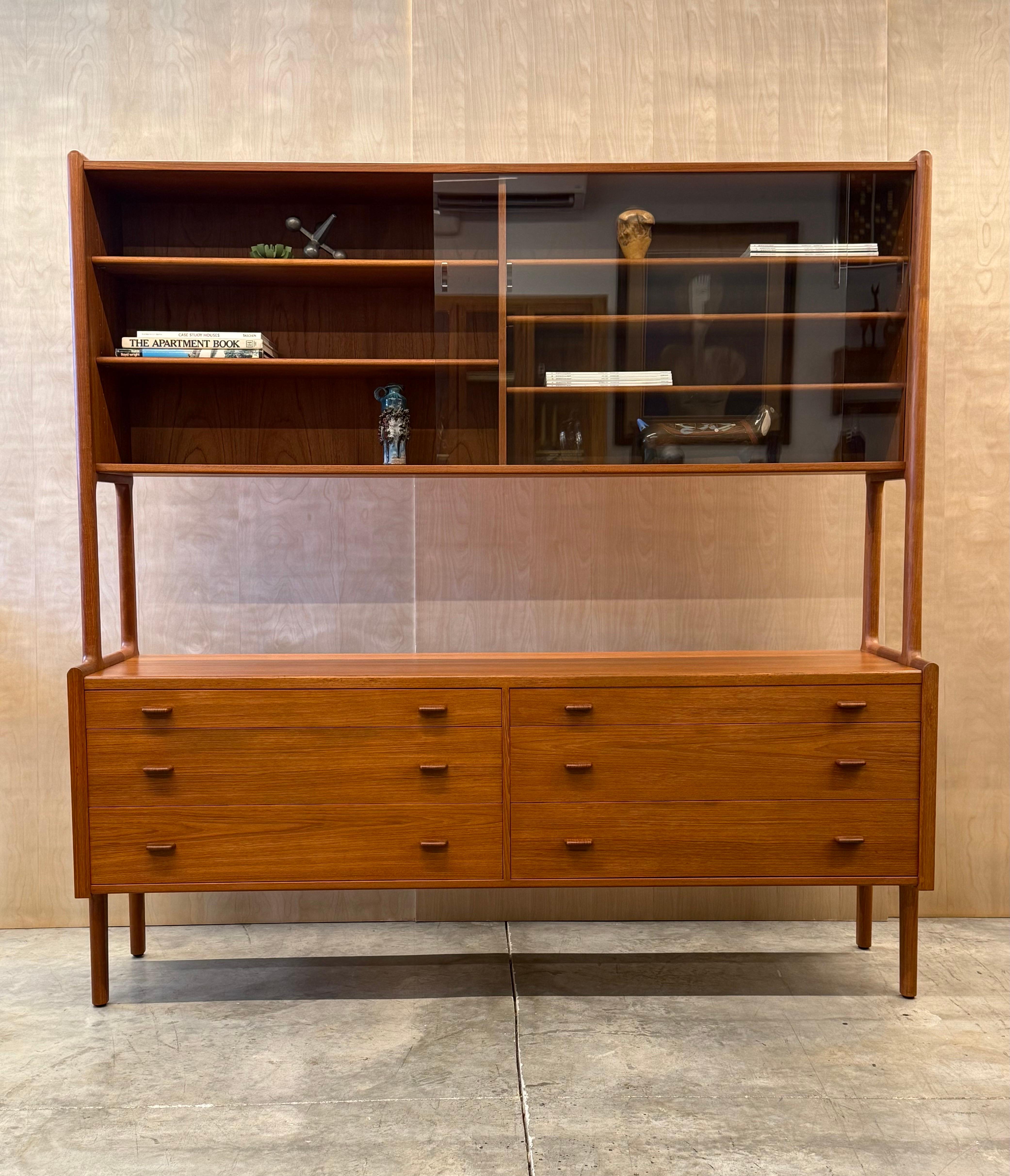 Mid-century model no.20 sideboard designed by Hans. J. Wegner for RY Møbler, Denmark. This two-tiered beauty is a coveted piece of iconic mid-century design. Originally designed in 1949 and crafted from teak wood. This sleek double cabinet showcases