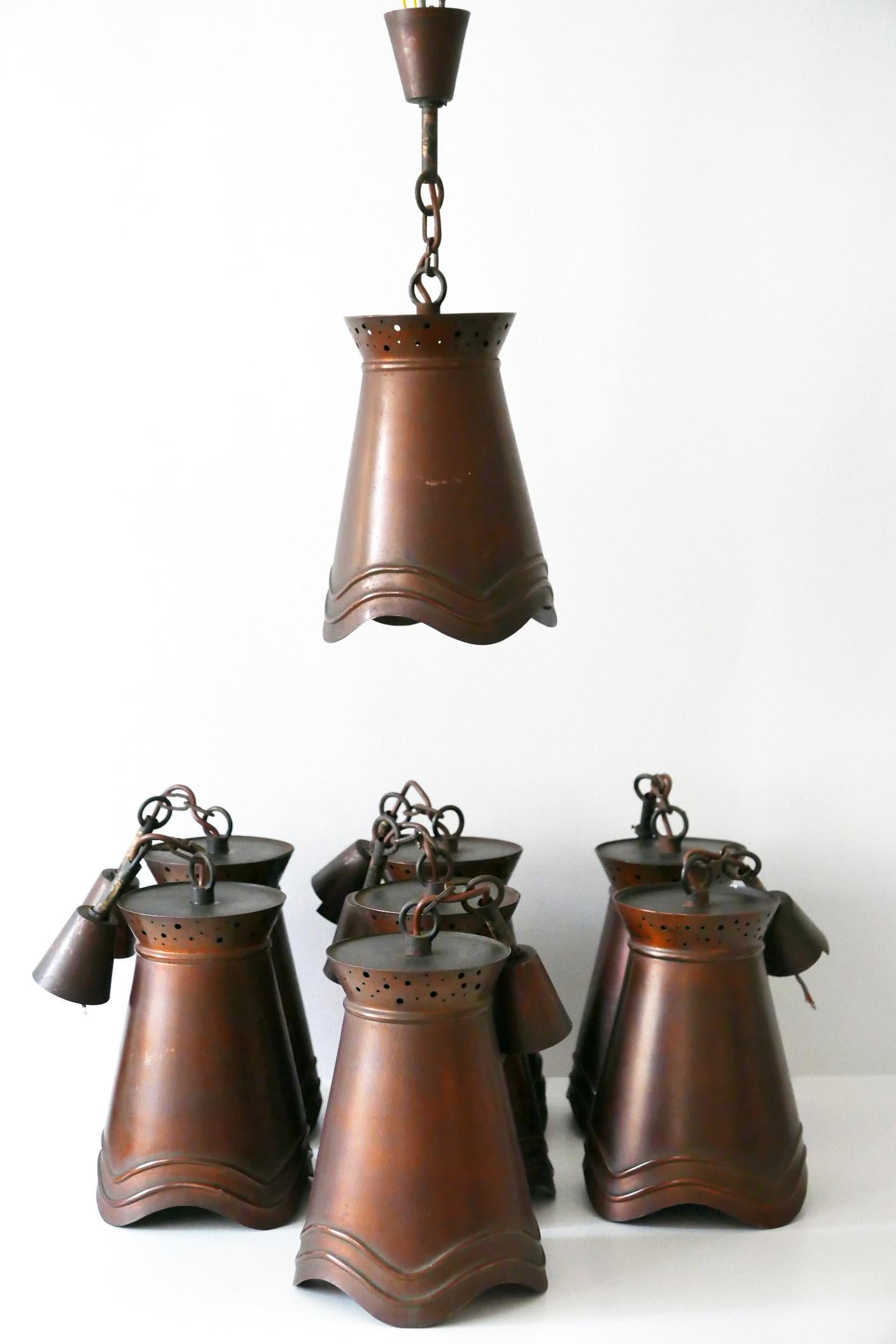 Rare and elegant Mid-Century Modern copper pendant lamps or hanging lights. Manufactured in Germany, circa 1950s.

Executed in copper, each lamp comes with 1 x E27 / E26 Edison screw fit bulb holder, is wired, and in working condition. It runs