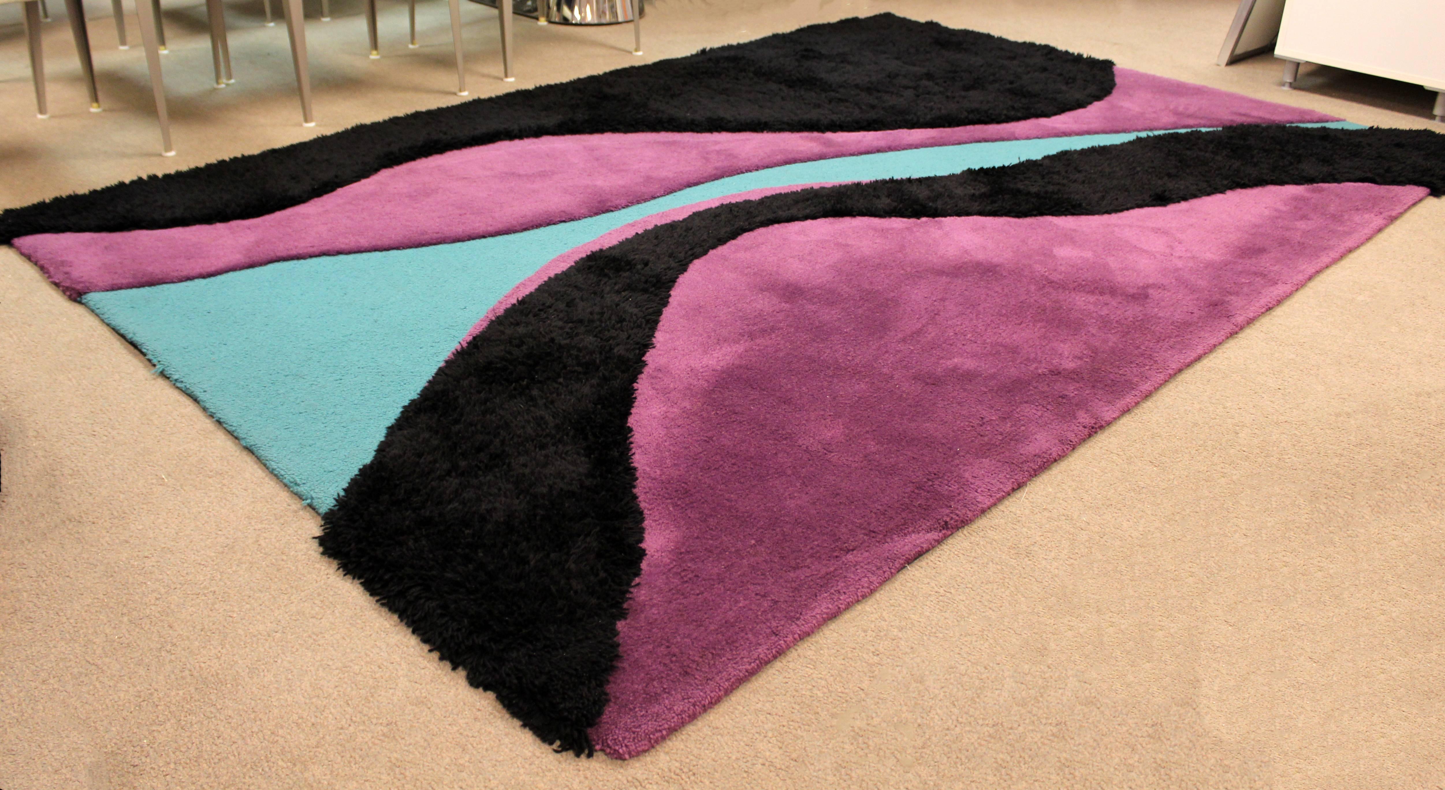For your consideration is a fabulous area rug, made of 100% New Zealand wool colored black, teal and purple, by Carter Carpets, circa 1970s. In excellent condition. The dimensions are 110