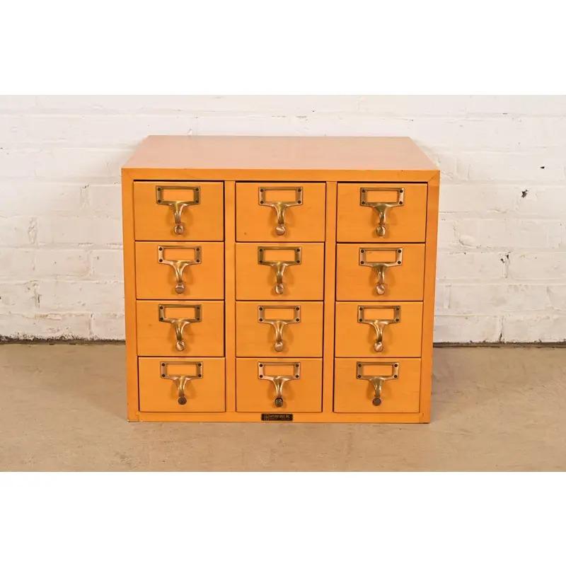 A rare Mid-Century Modern 12-drawer library card catalog or file cabinet 

By Gaylord Bros. 

USA, Circa 1950s

Maple, with original brass hardware.

Measures: 20.13