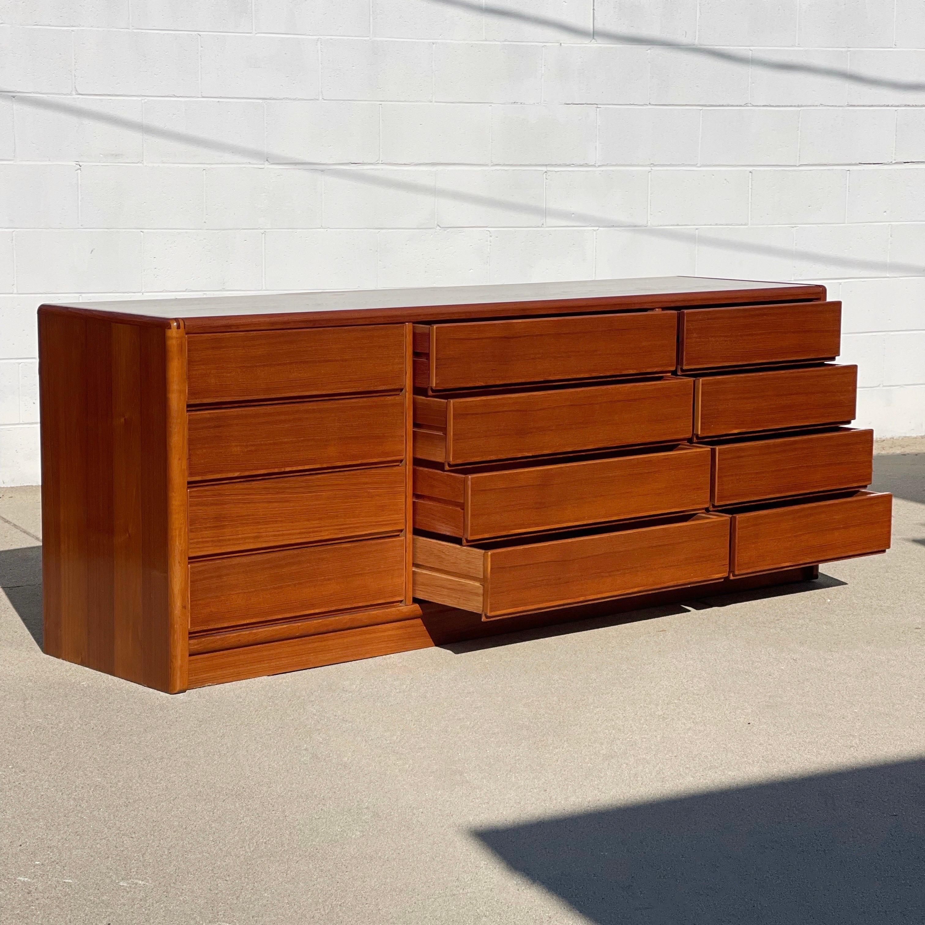 Stunning teak dresser designed by Dscan. This dresser uniquely has 12 drawers so it has amazing storage! 