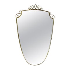 Mid-Century Modern 1950s mirror, with Gio Ponti style brass frame and decoration