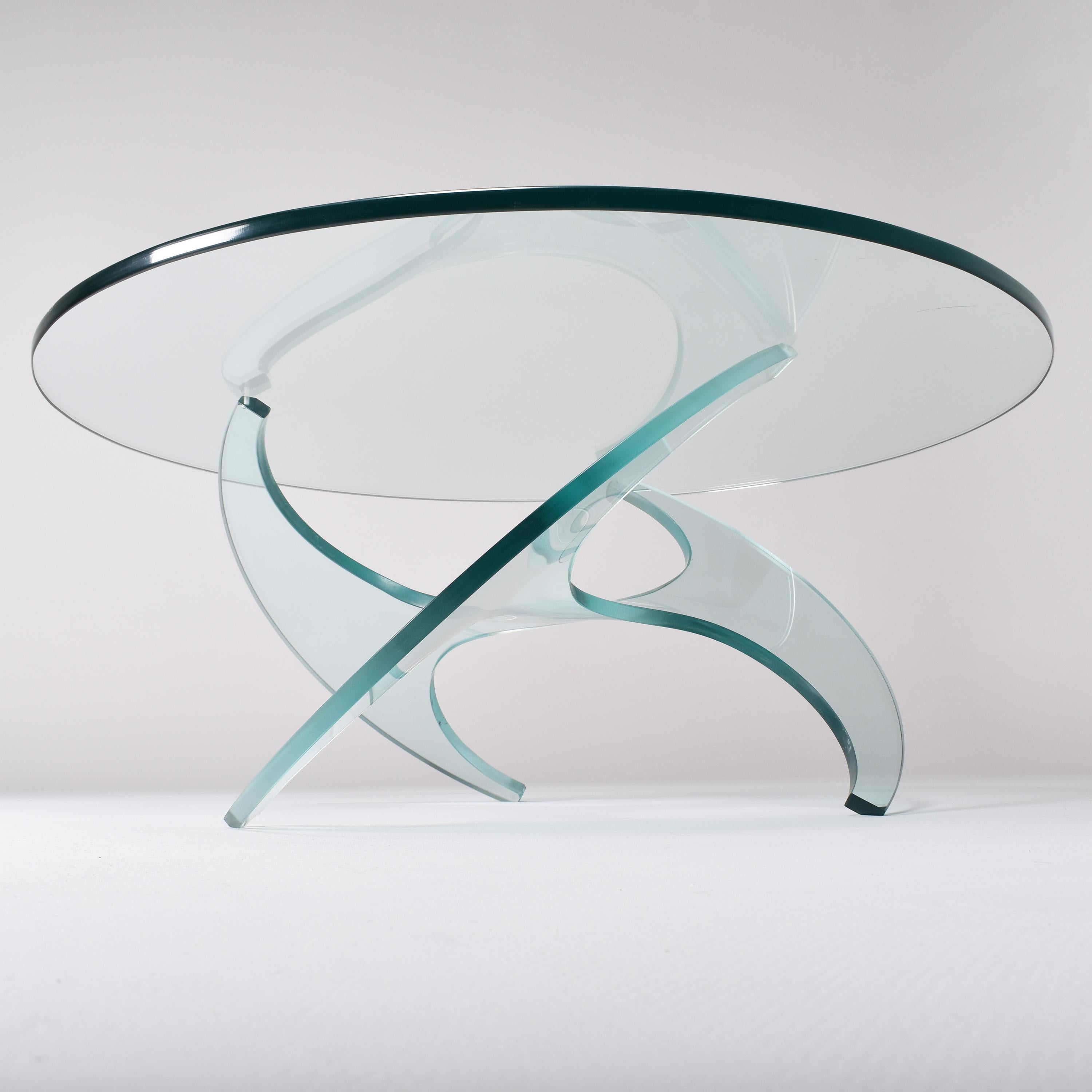 This round coffee table is the rare glass version of the 