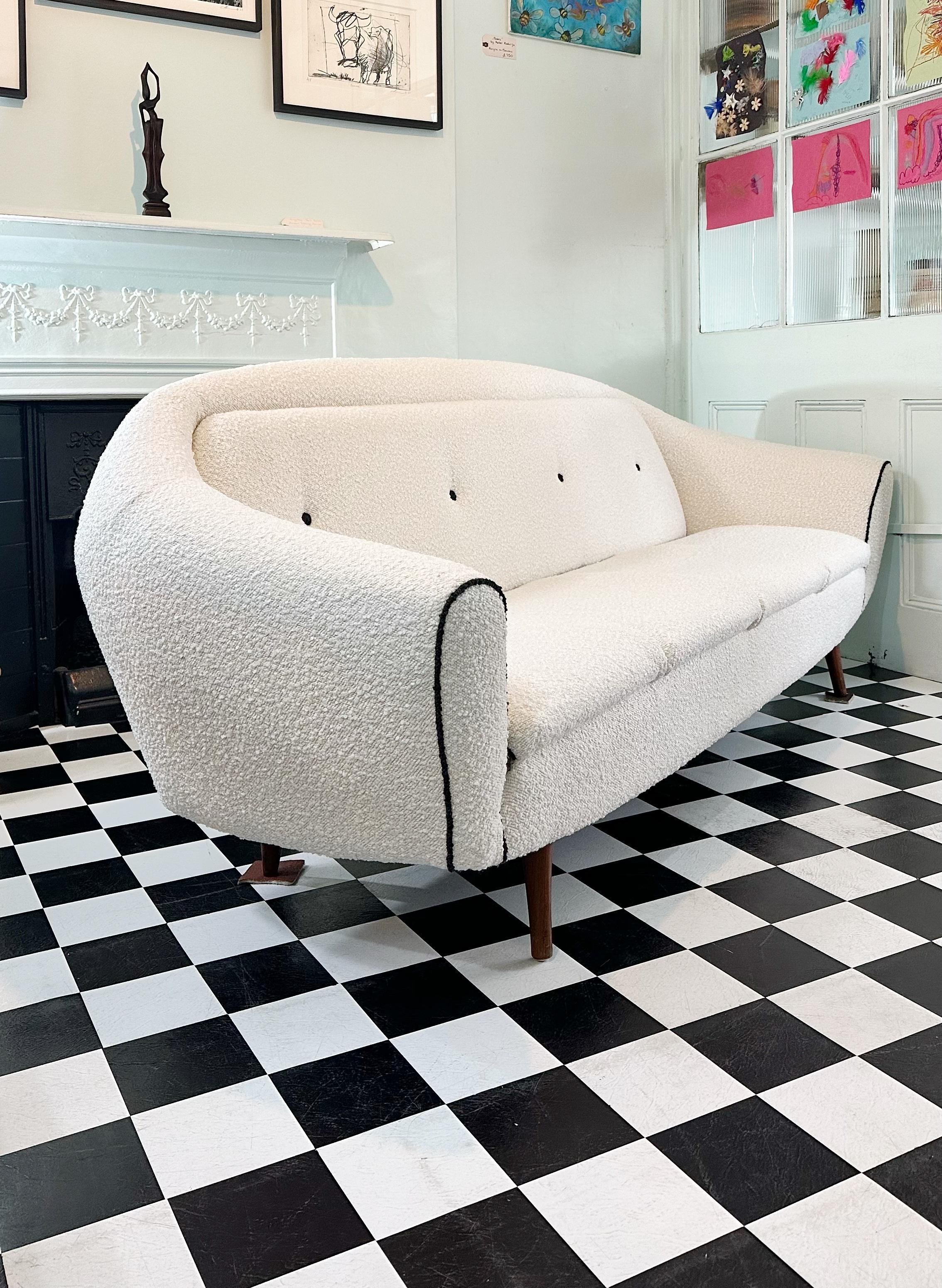 Stunning mid-century 1960’s Greaves and Thomas sofa bed with padded armrests.
Beautifully deigned to offer a lot of style as well as great comfort and functionality. 
It has been fully restored and reupholstered in top quality boucle fabric by