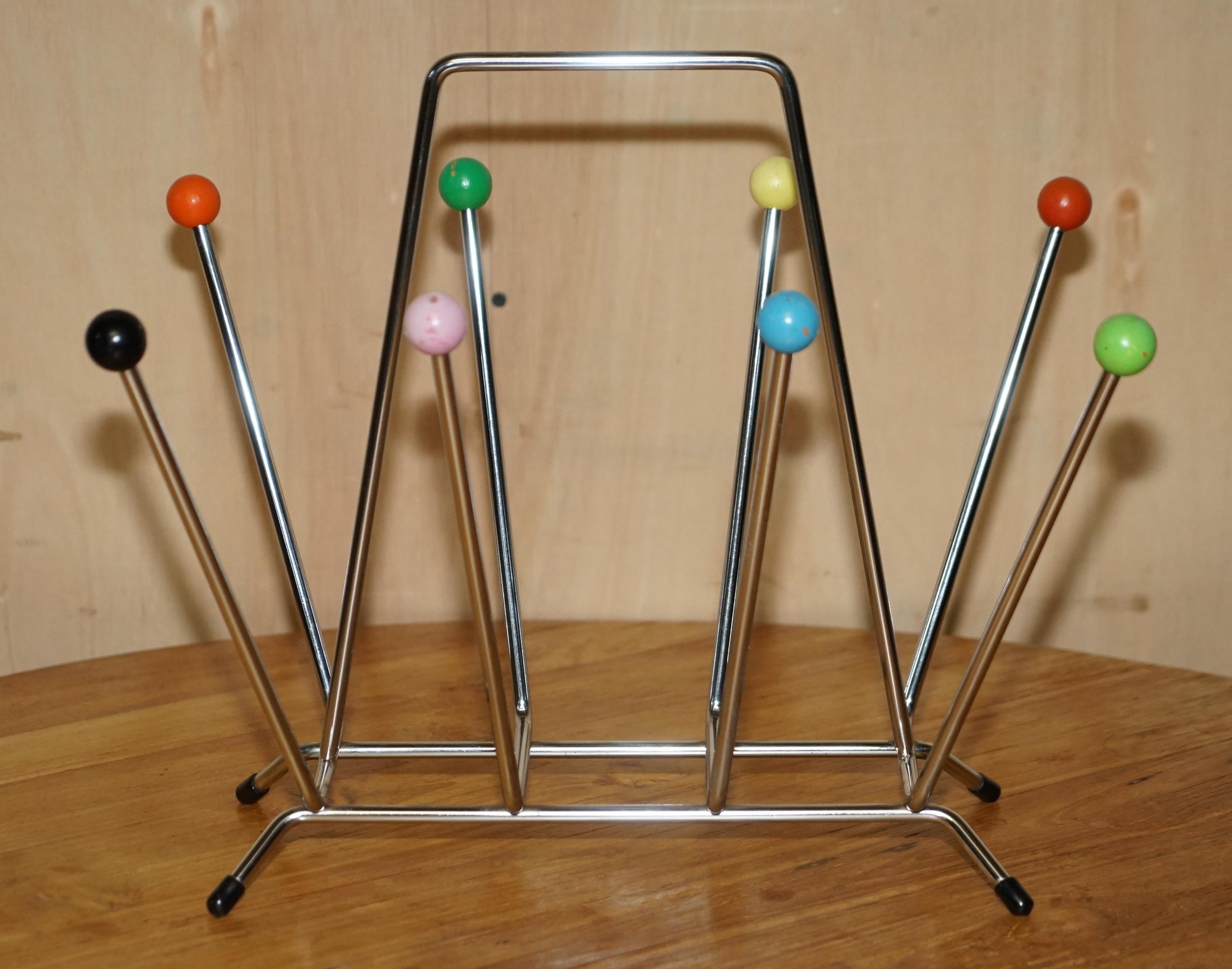 Royal House Antiques

Royal House Antiques is delighted to offer for sale this lovely original circa 1960's Vitra Eames Sputnik Atomic space race magazine rack

A highly decorative, well made and collectable piece that looks amazing from every