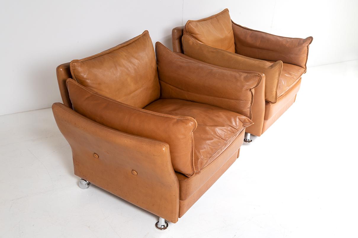 A stylish pair of tan leather armchairs by Danish designer Svend Skipper.  Circa 1980s, these high quality pieces have a strong design with good form and colour and would work well in a contemporary interior design scheme.
Very comfortable seating