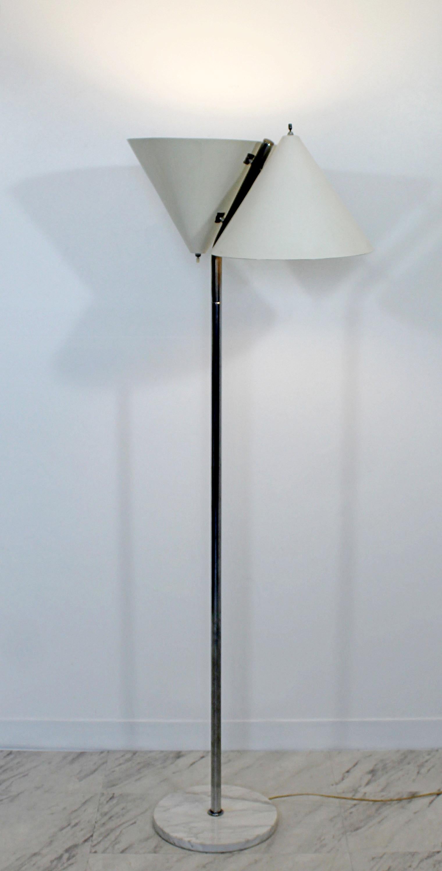 For your consideration is a wonderful, tall, Dual head floor lamp, on a white marble base, made in Italy, in the style of Arteluce, circa 1960s. In very good condition. The dimensions are 24