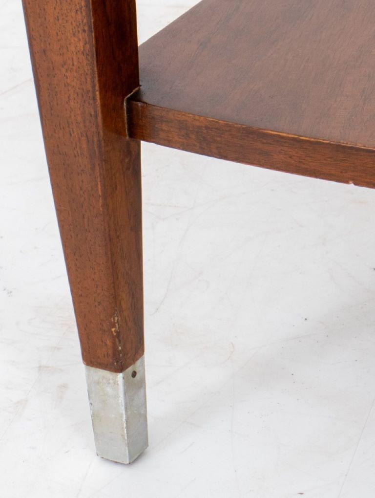 Mid-Century Modern Two-Tiered Wooden Side Table, angled form on four tubular legs terminating in brass feet.

Dealer: S138XX