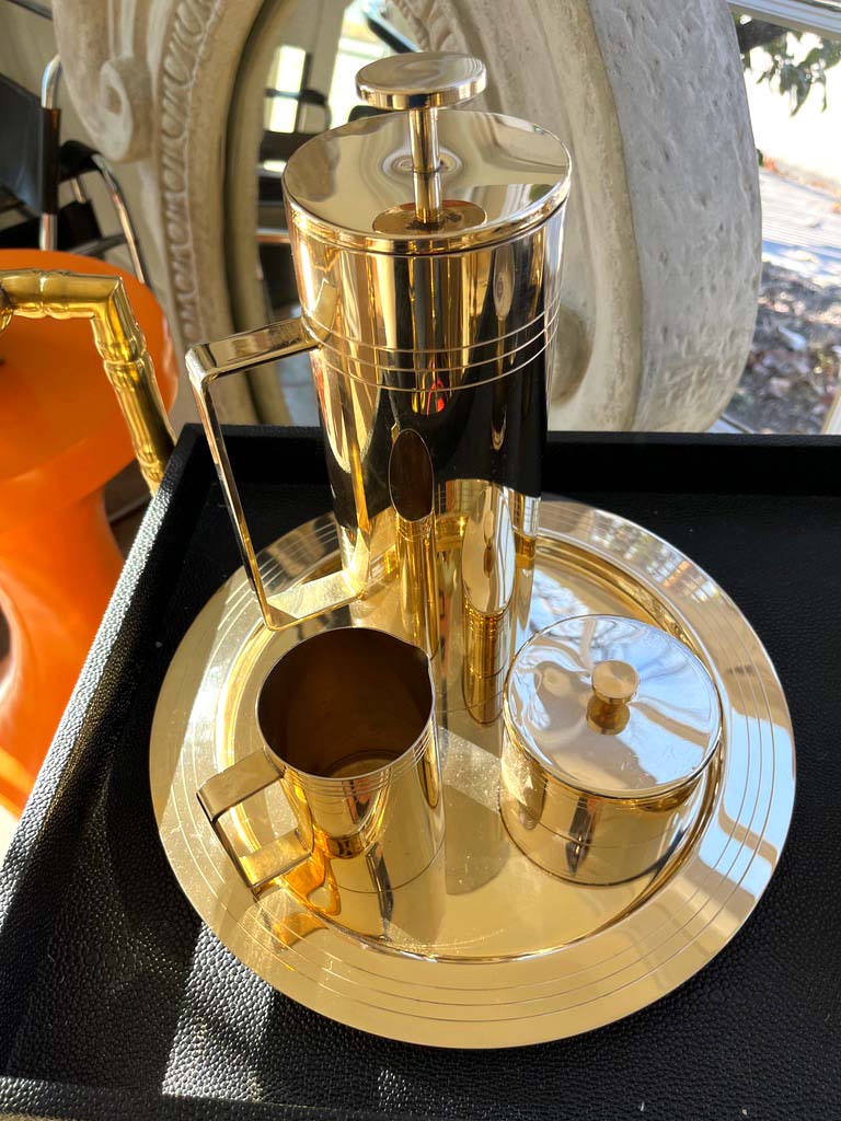 Beautiful 6 piece Mid-Century Modern coffee or tea service stamped 24k GF on the bottom. The plating layer is 24K gold electroplated over silver. This is a wonderful piece for a bar or to use on a daily basis. 

Dimensions 
Plate 12” Diameter