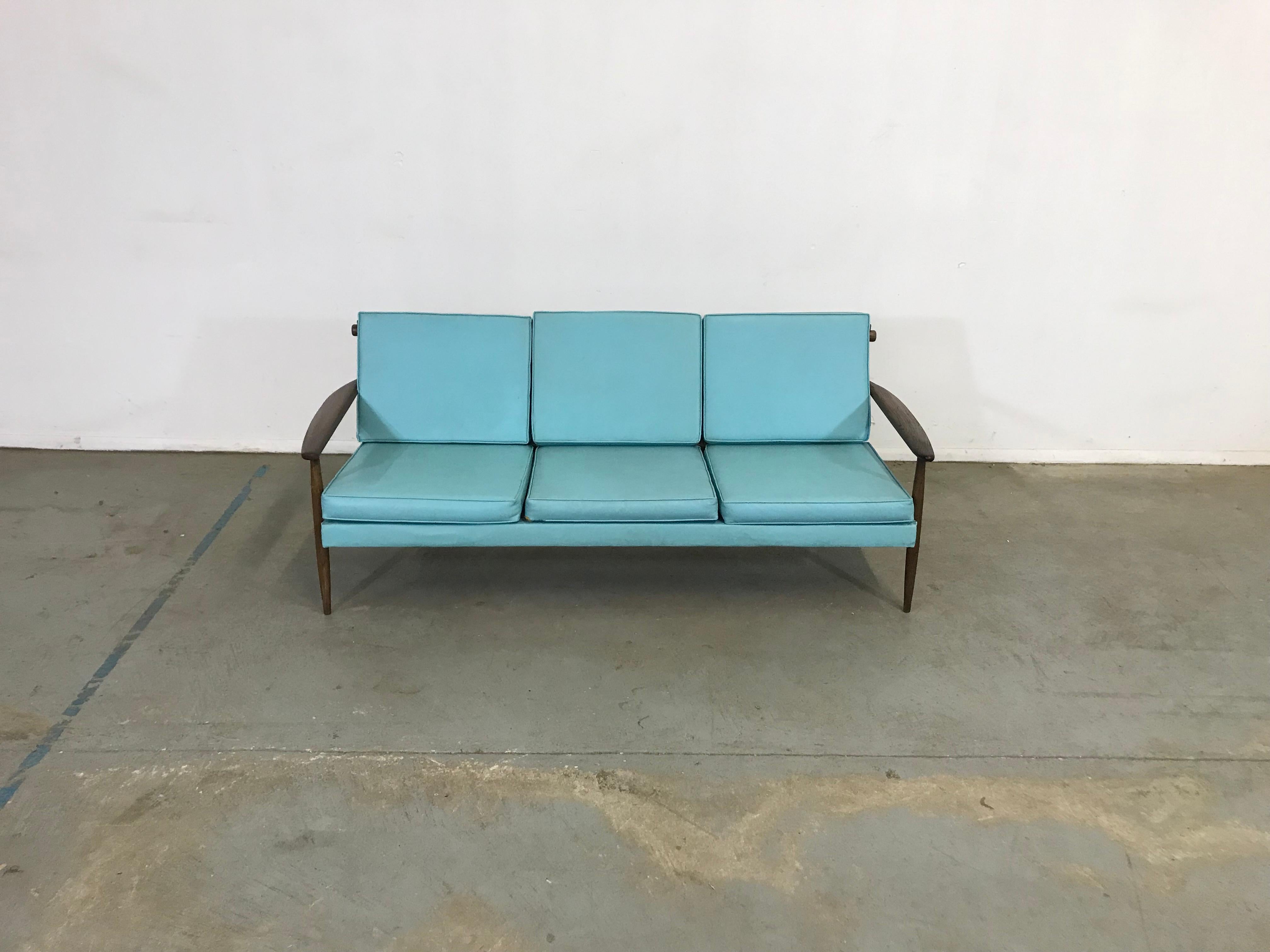 Mid-Century 3 cushion vikko sofa

Offered is an unrestored Mid-Century Modern sofa. The sofa can stand to be reupholstered but it is overall structurally sound. Has some scratches on the legs. The upholstery has staining and fading and some tears.