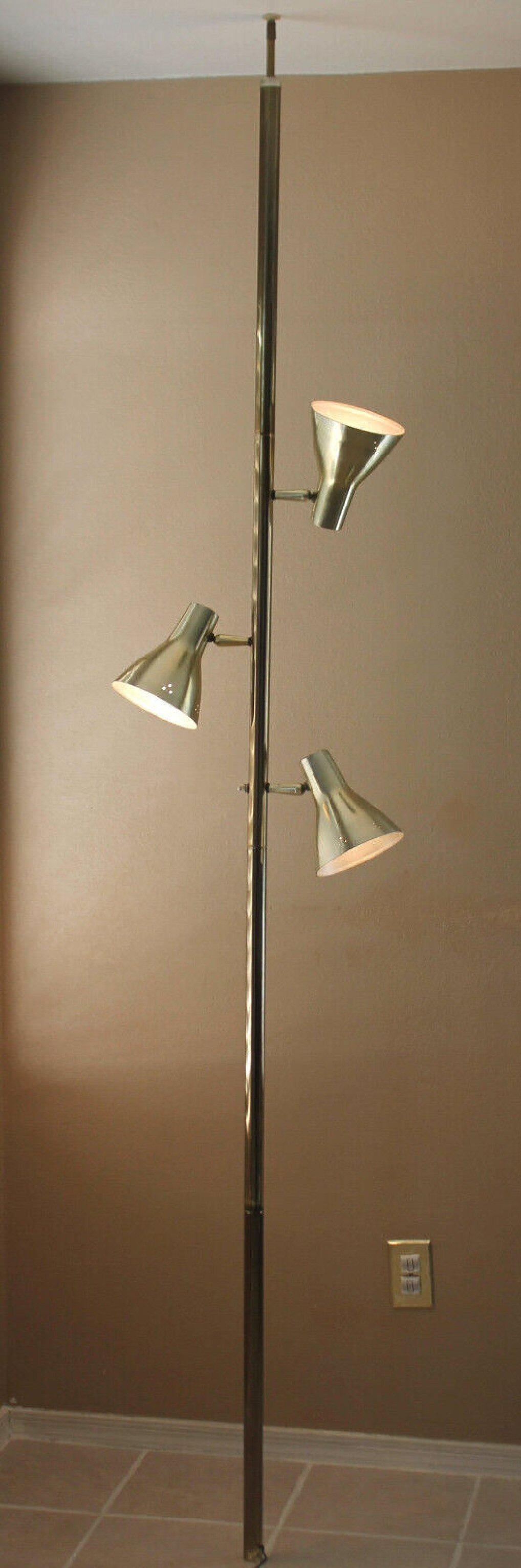 
CLASSIC!

ATOMIC AGE
MID CENTURY MODERN
ALUMINUM CONE SHADE
TENSION POLE LAMP!

GOOD DESIGN!
CIRCA 1959-60
(FITS 8 FT. CEILING)

Offered is another Magnificent Mid Century Tension Pole Lamp!
A super clean design in gold that blends ergonomics
with