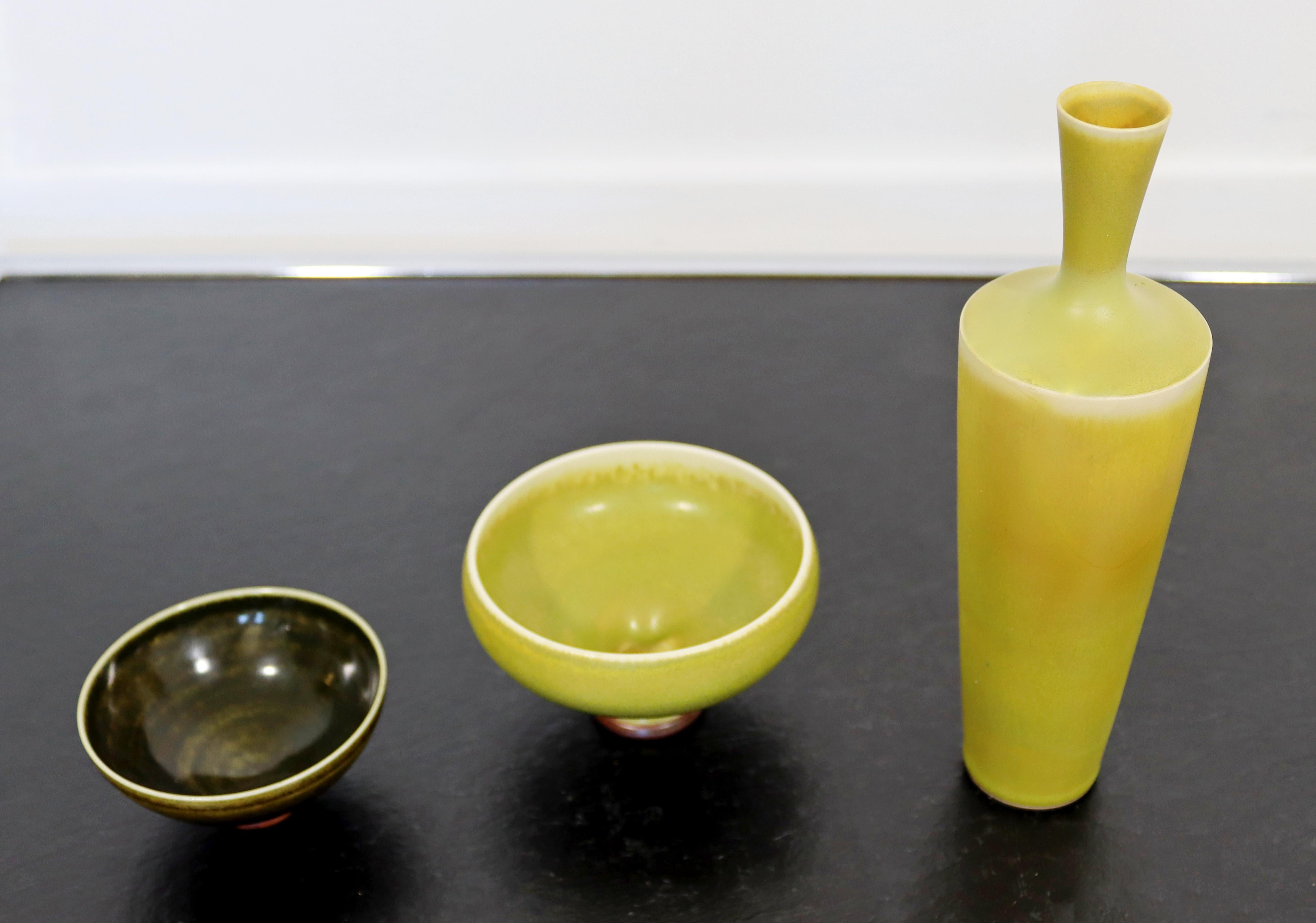 For your consideration is a fabulous, ceramic set of small bowls and matching vase, with green and yellow glaze, made in Sweden, all signed on the base by Berndt Friberg, circa the 1960s. In excellent condition. The dimensions of the vase 2.5