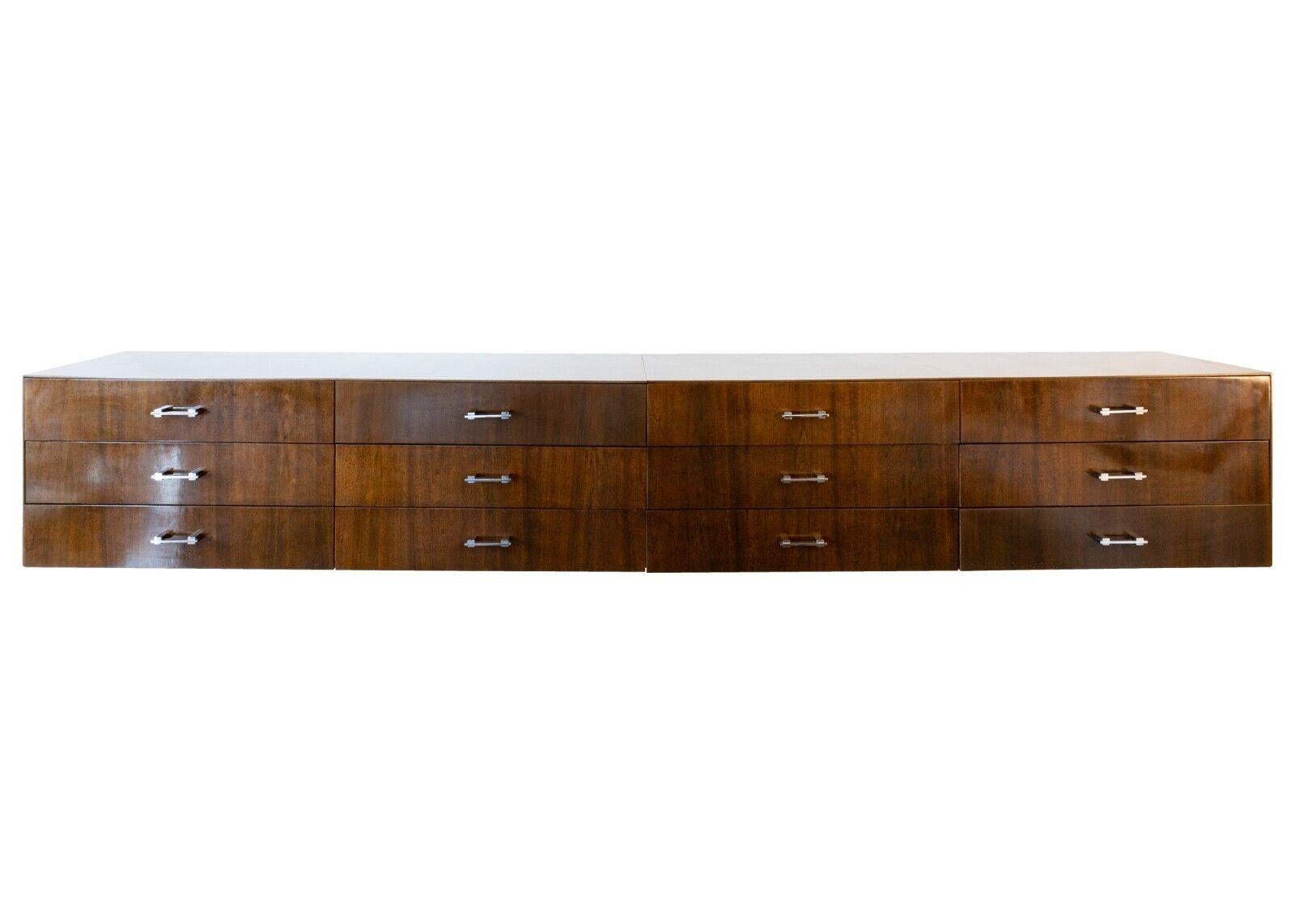 A gorgeous 3 piece walnut and chrome Tobocman hanging/floating credenza set. This stunning wall unit set features a walnut construction with a semi-glossy finish, and rectangular chrome drawer handles. This set of 3 comes unattached but can be hung