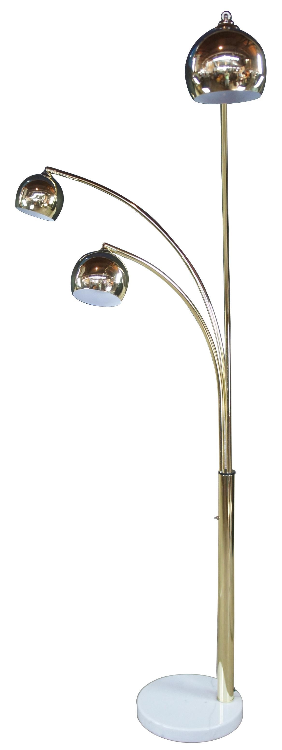 1960s 3 arm adjustable arc floor lamp. Polished brass over a white marble base. In the manner of Robert Sonneman.
 