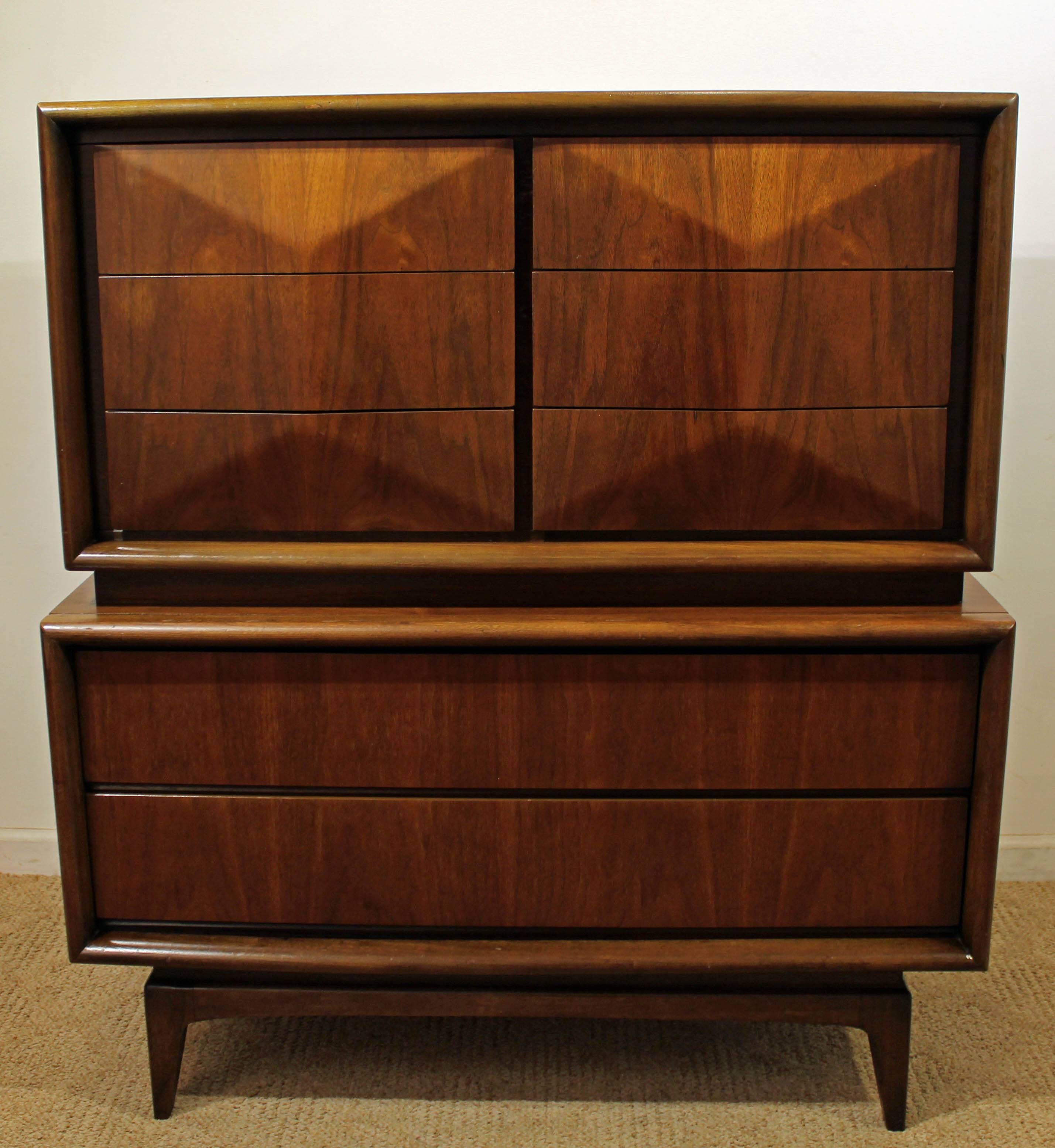 Offered is a walnut tall chest, made by United Furniture. It is signed.

Dimensions: 44