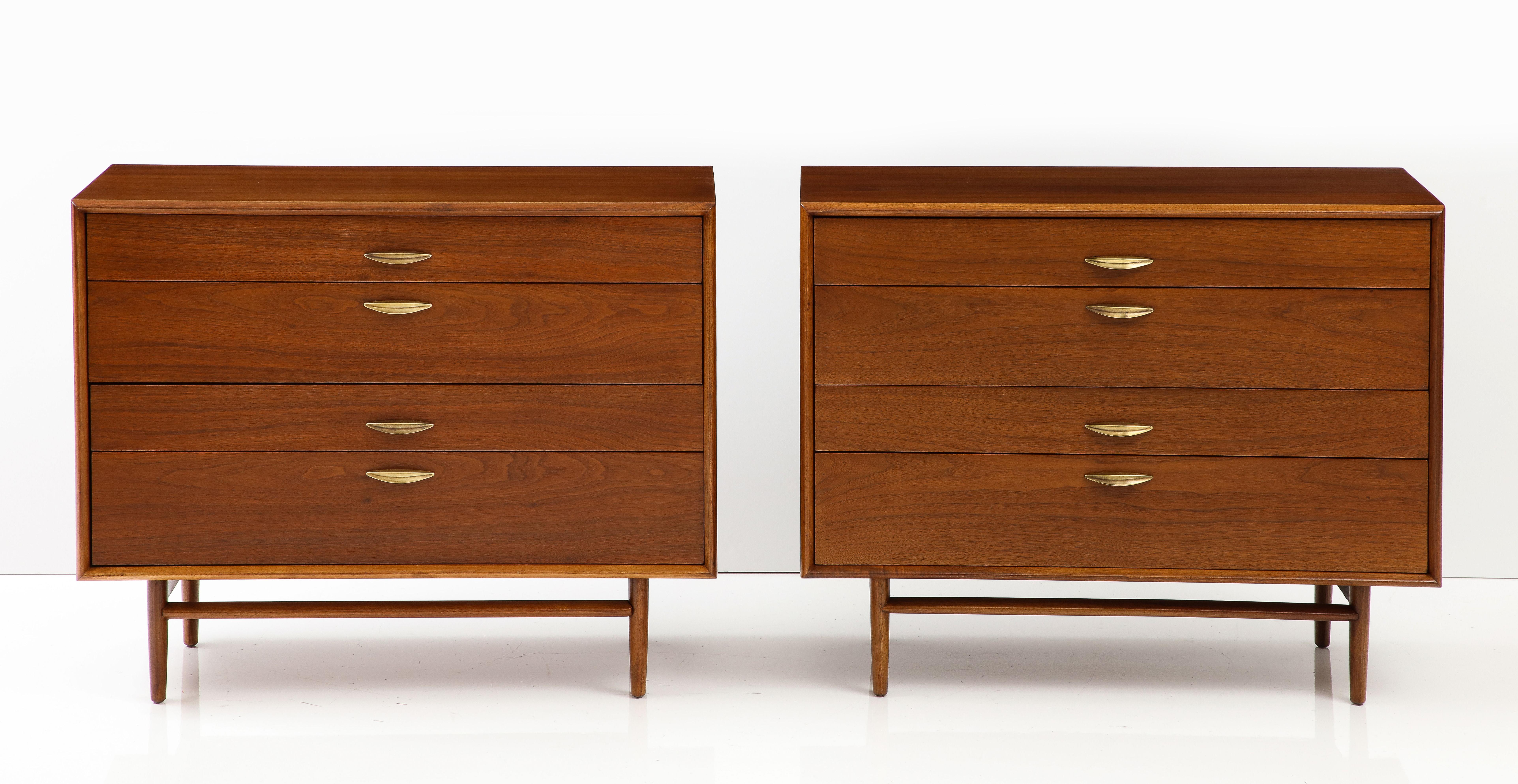 Amazing pair of late 1950's drexel 4 drawer walnut dressers with solid brass handles from the Parallel Collection, fully restored with minor wear and patina due to age and use.