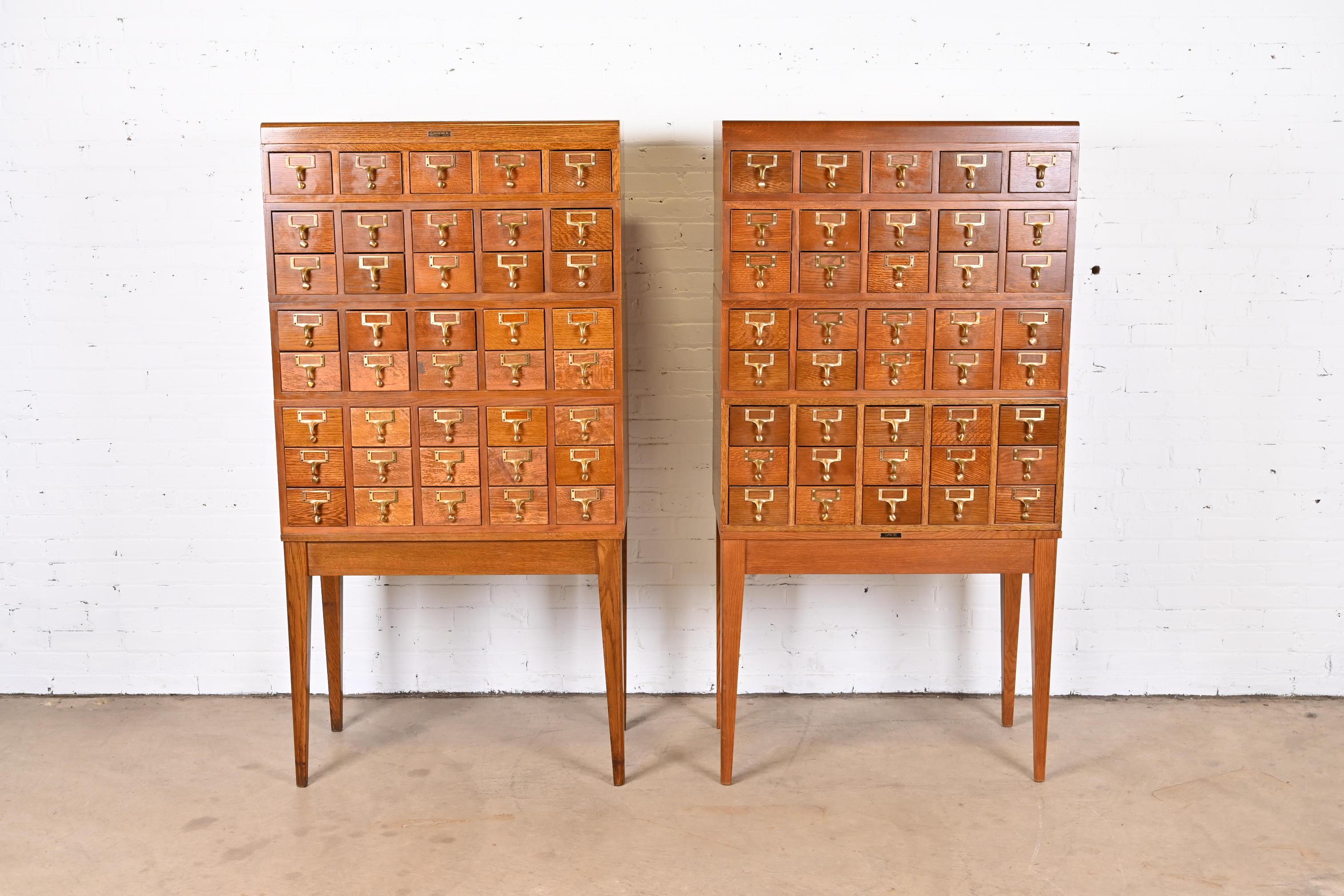 A rare and exceptional pair of mid-century modern 40-drawer library card catalogs

By Gaylord Bros.

USA, Circa 1950s

Quarter sawn oak, with brass hardware.

Measures: 33