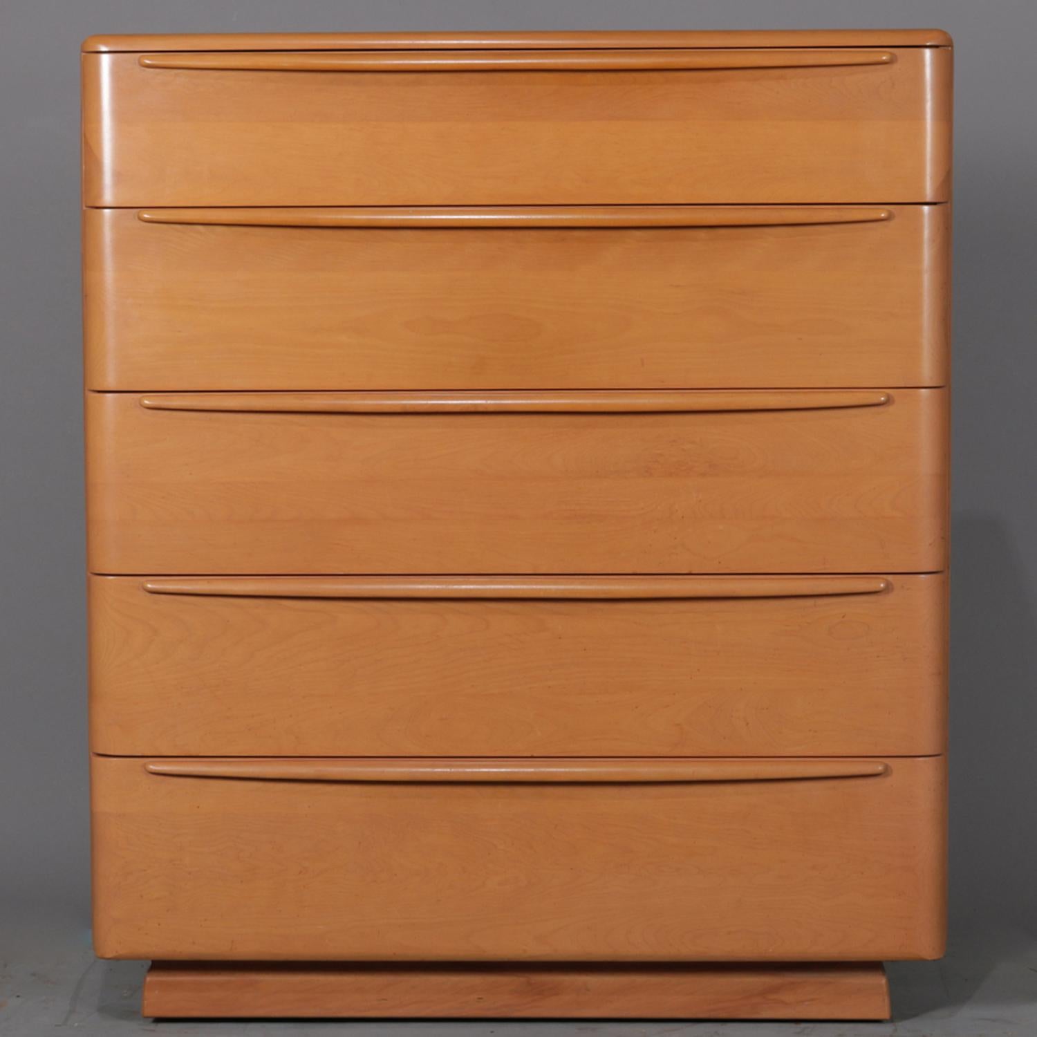Mid-Century Modern highboy dresser by Heywood Wakefield features five drawers, single skirted foot with wheels, brand stamp on drawer interior, en verso Champagne finish identifier, circa 1950.

***DELIVERY NOTICE – Due to COVID-19 we are employing