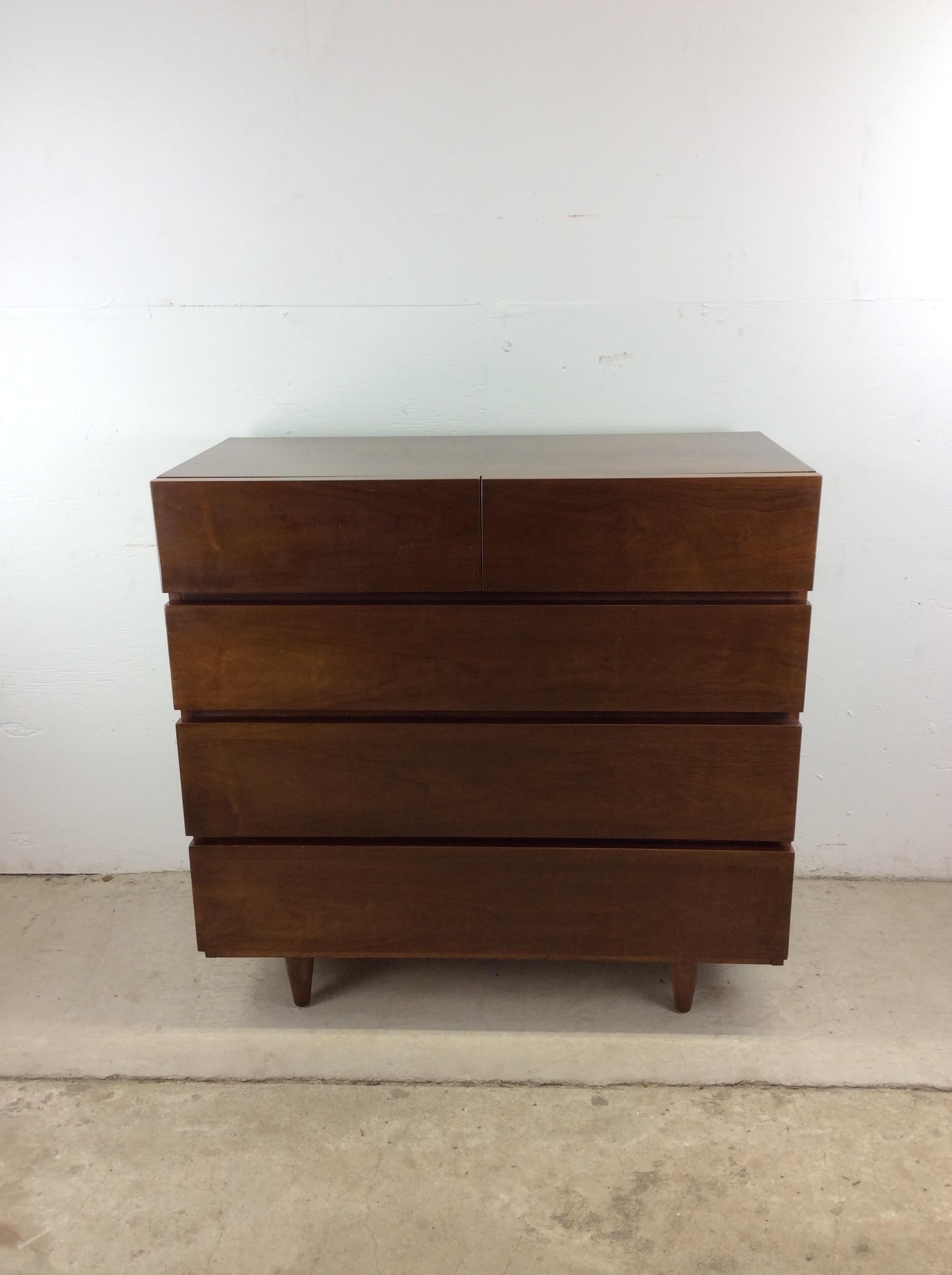 This mid century modern Highboy dresser by American of Martinsville features hardwood construction, original walnut finish, five dovetailed drawers and small tapered legs.

Dimensions: 40.25w 19.75d 38.75h  

Condition notes: Original walnut finish