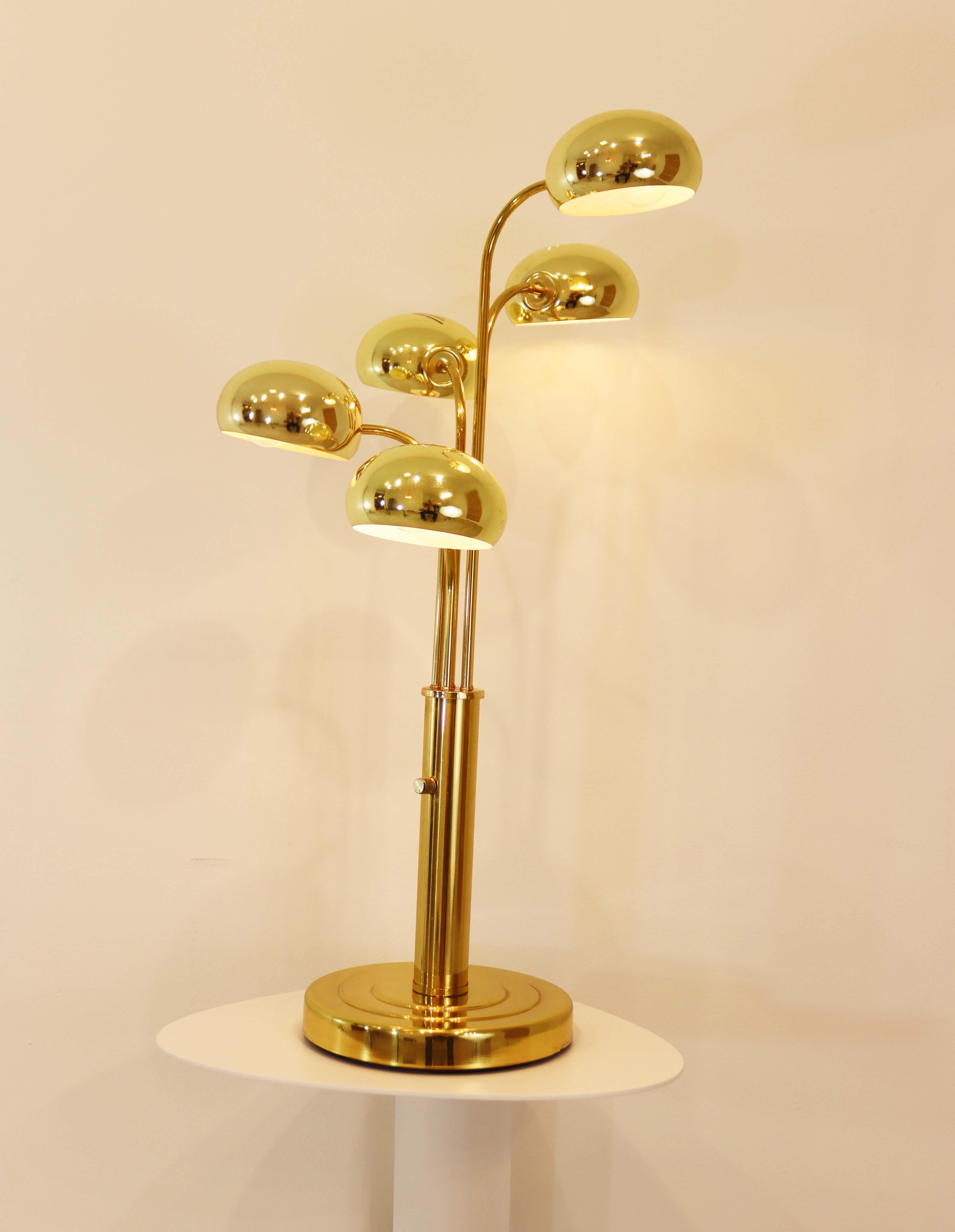 This brass 5 Light is exemplary of the late Mid-Century Modern design and feature 5 independent articulating heads with a single adjustable dimmer switch. This cascading waterfall lighting is a versatile addition to most aesthetics.
 