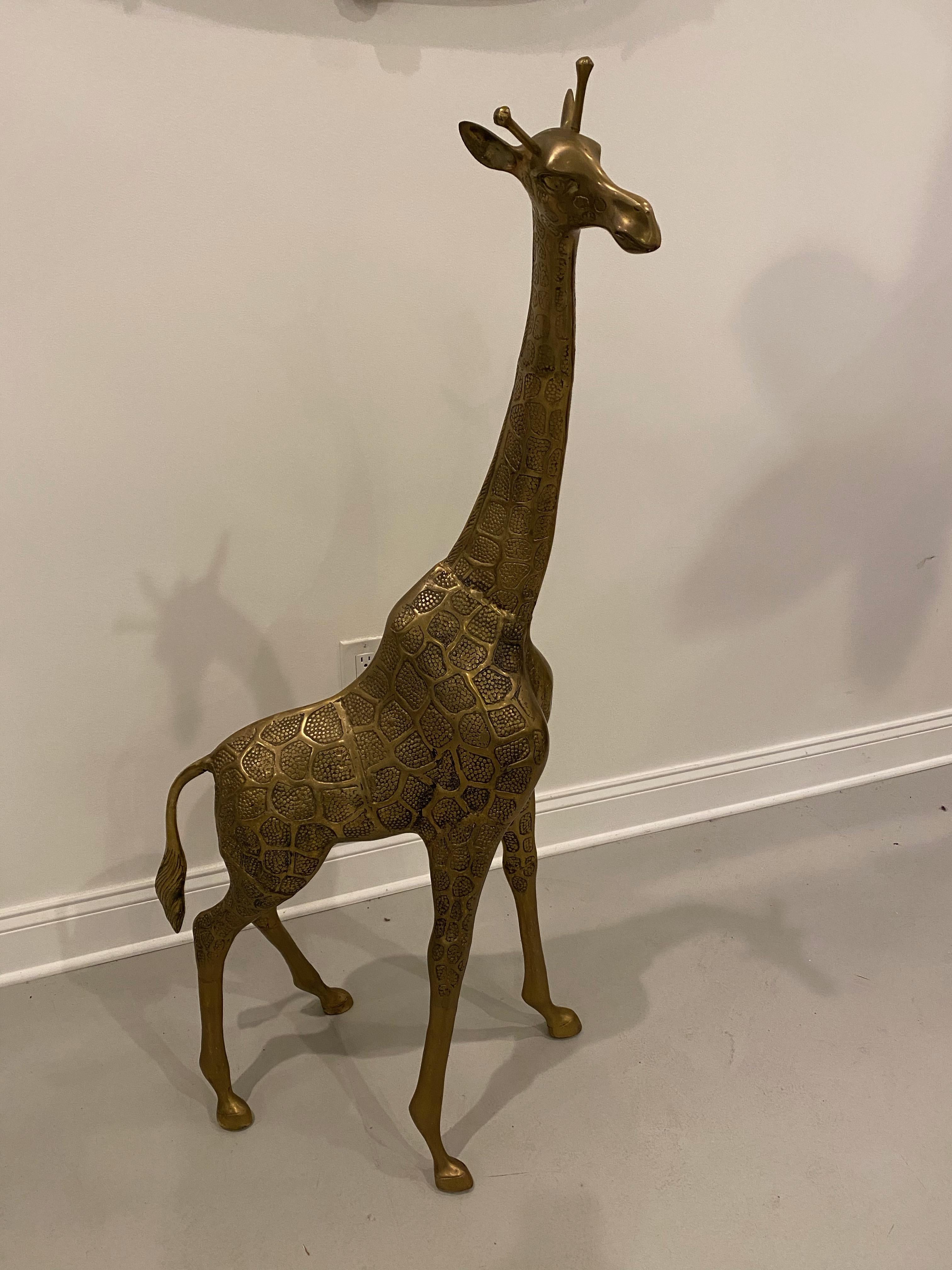Midcentury standing metal giraffe with beautiful details throughout. Some signs of oxidation. Please look through all images. Measures: 52 inches.