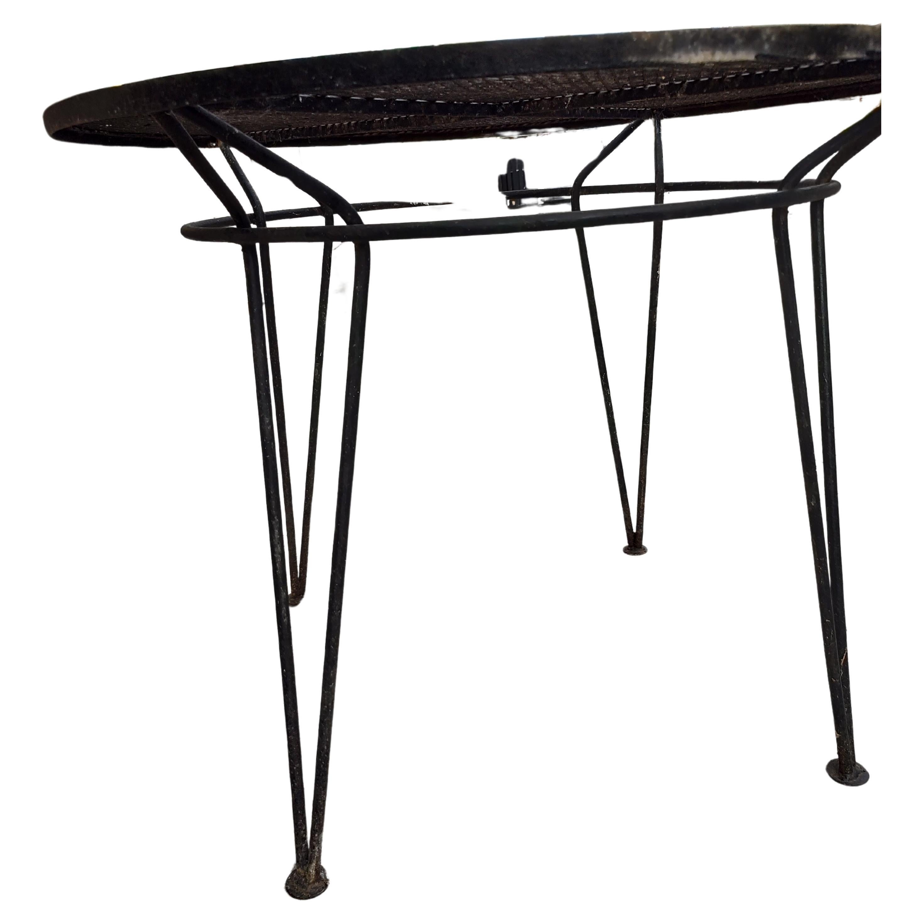 Fabulous 5 piece set which includes 4 iron hoop chairs and a iron table. Table is 36.25 in diameter x 29h. In excellent vintage condition with minimal wear, some surface rust which we will clean off. Could use a paint job. Priced and Sold as a 5 PC