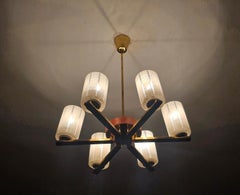 Mid Century Modern 6-arm Chandelier done in Brass, Teak and frosted glass