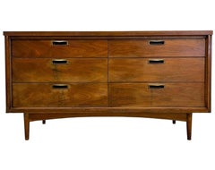 Mid Century Modern 6 Drawer Dresser with Sculpted Base and Brass-Toned Pulls.