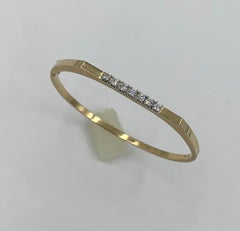 Bracelet moderne du milieu du siècle à 7 diamants en or jaune 14 carats