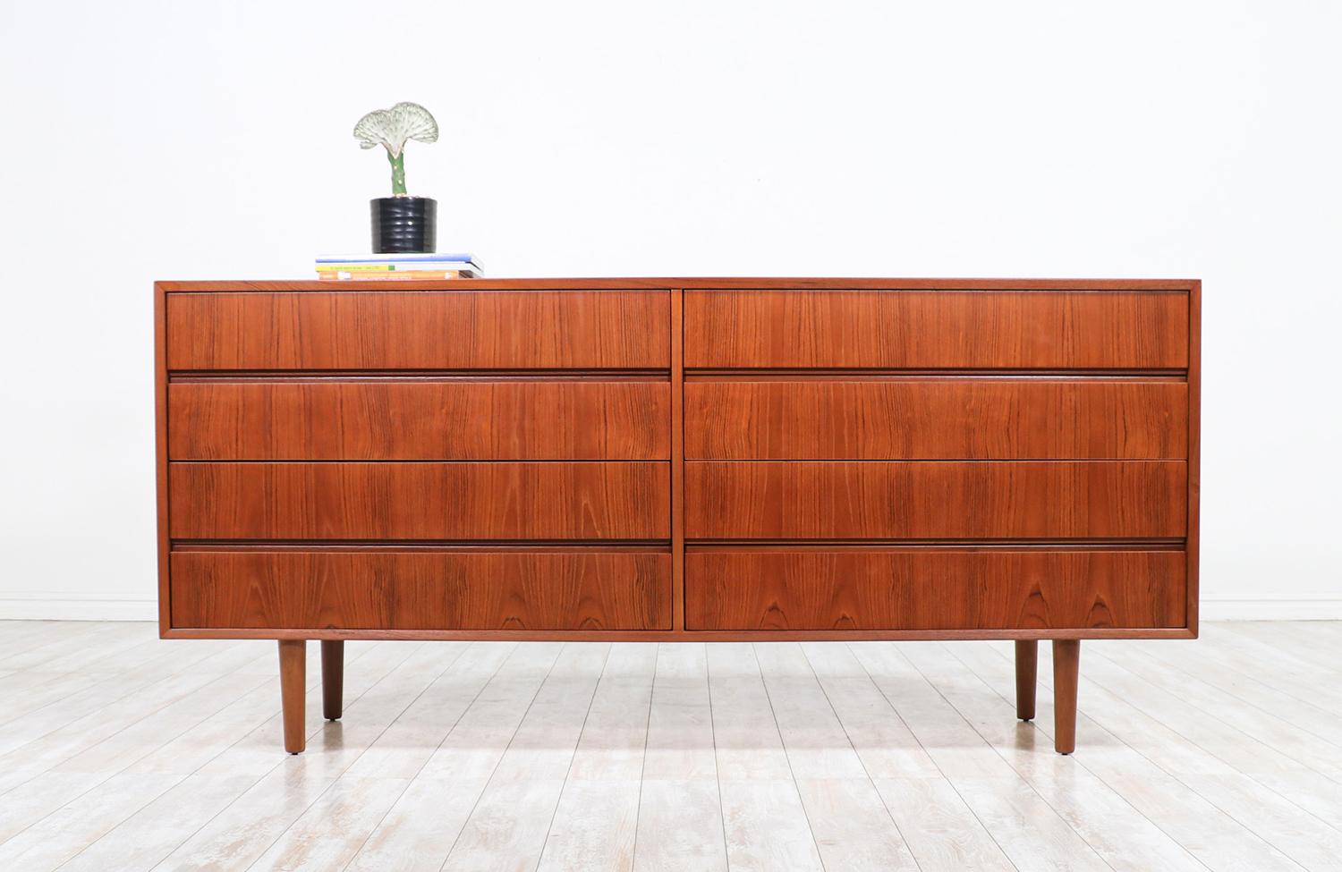 Mid-Century Modern 8-drawer teak dresser.