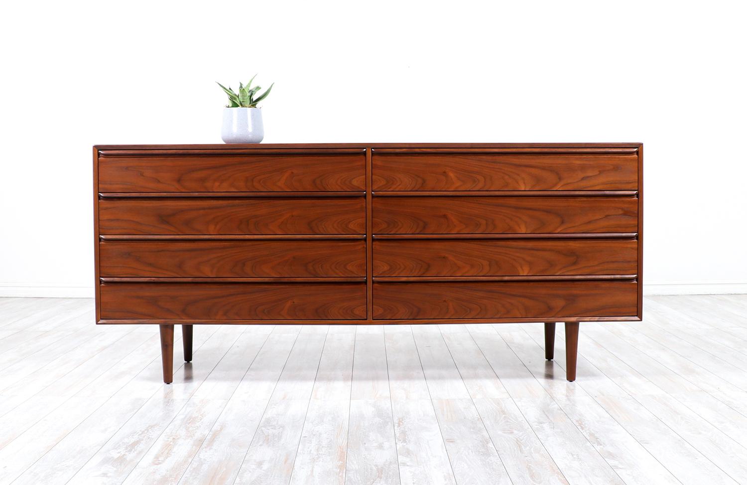Mid-Century Modern 8-drawer walnut dresser by Westnofa.